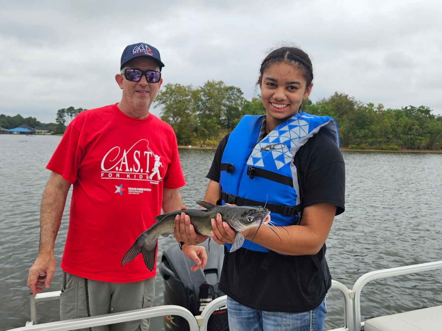 participant showing off fish at The Boulders at Lake Tyler