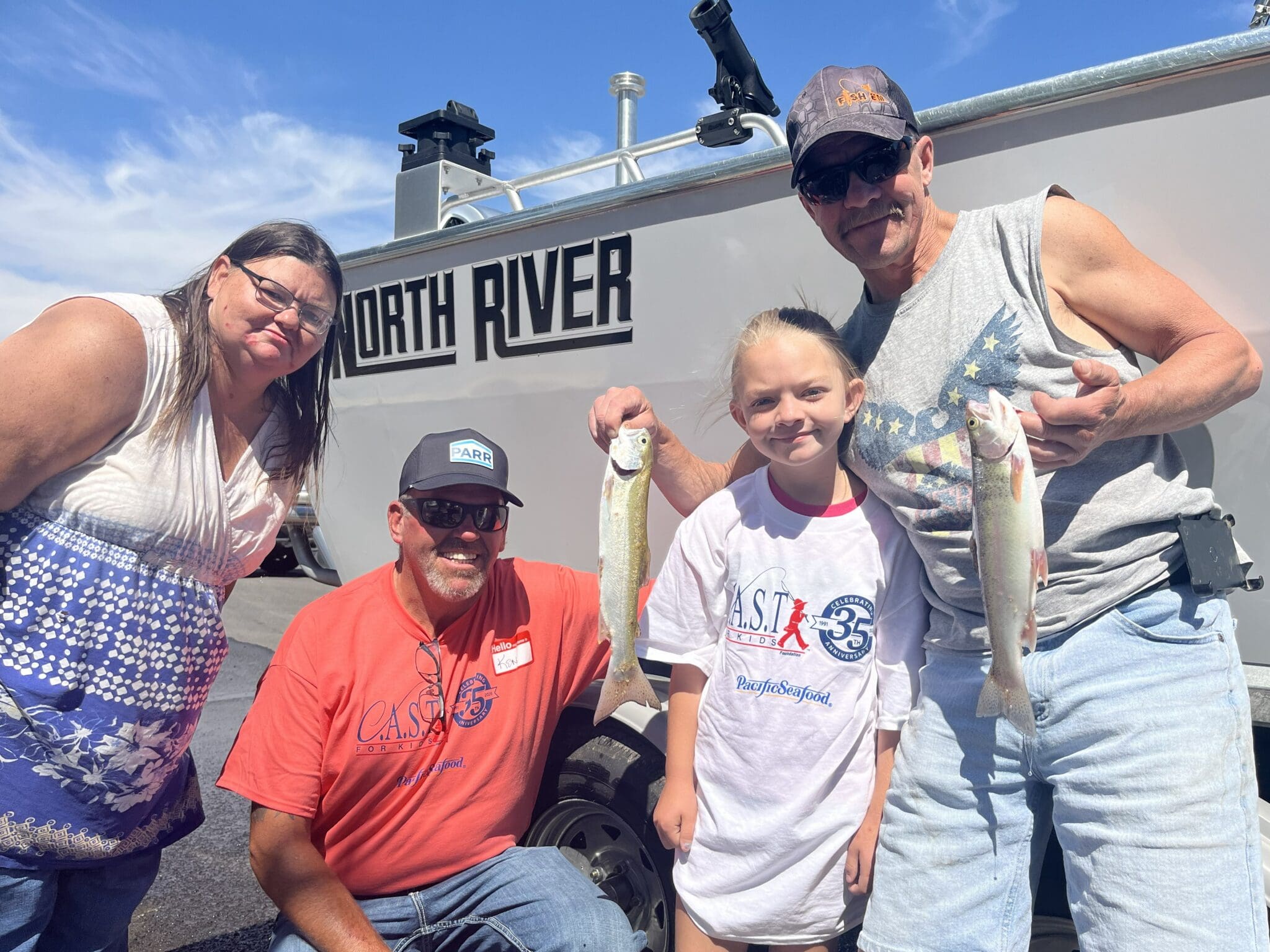 young kid showing off fish at prineville reservoir