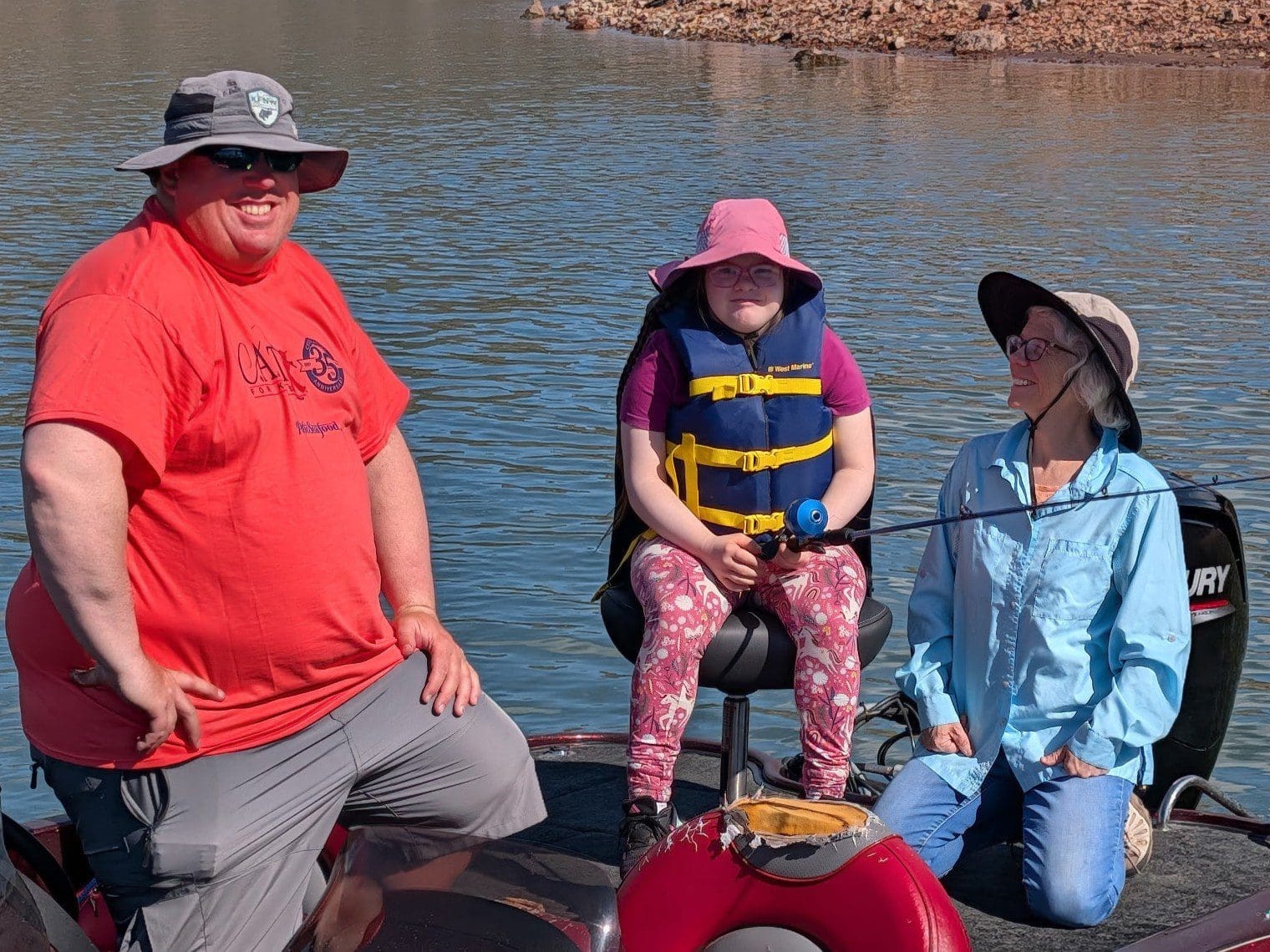 young girl showing fish at prineville reservoir