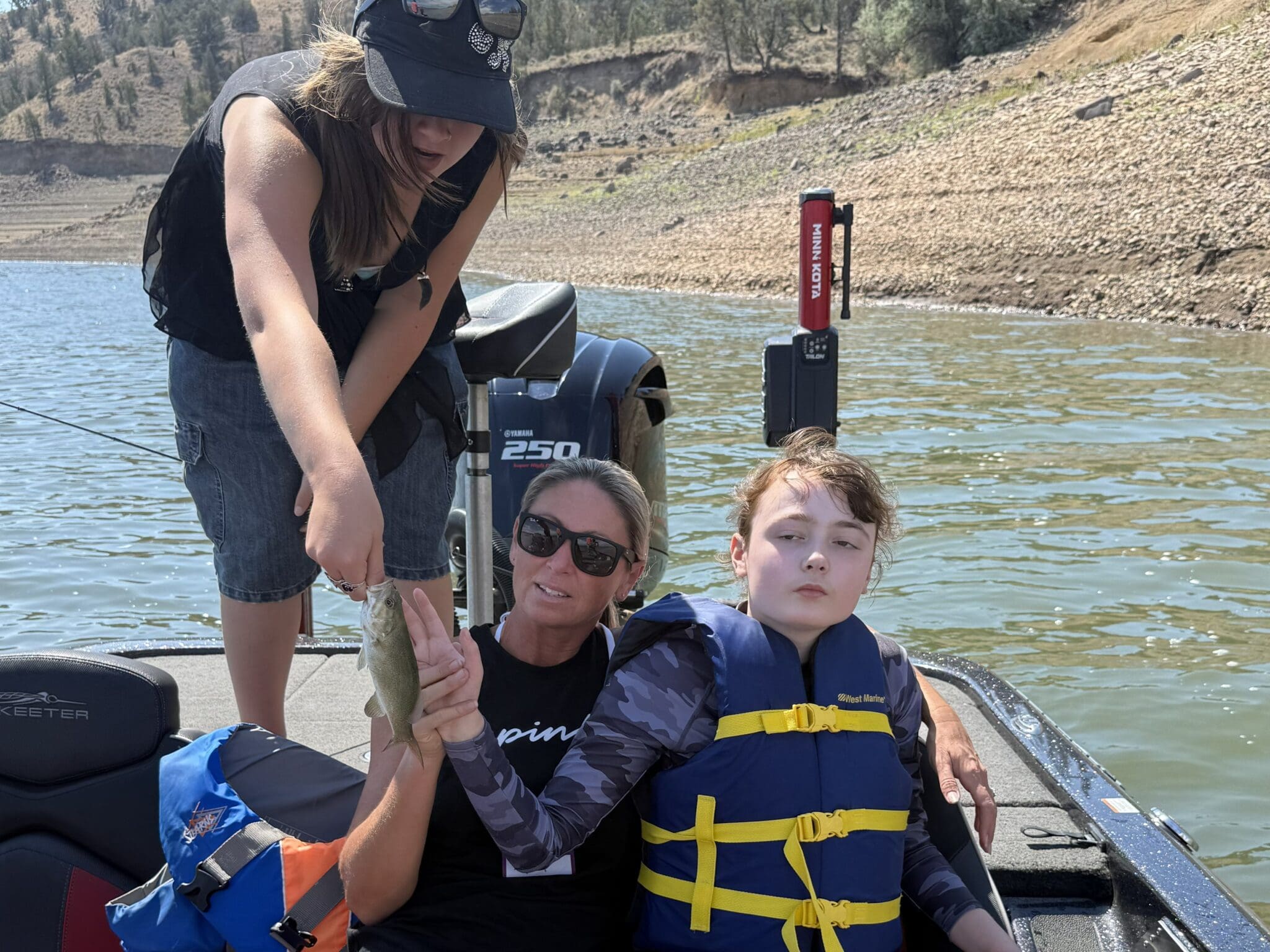young female participant showing fish at prineville reservoir