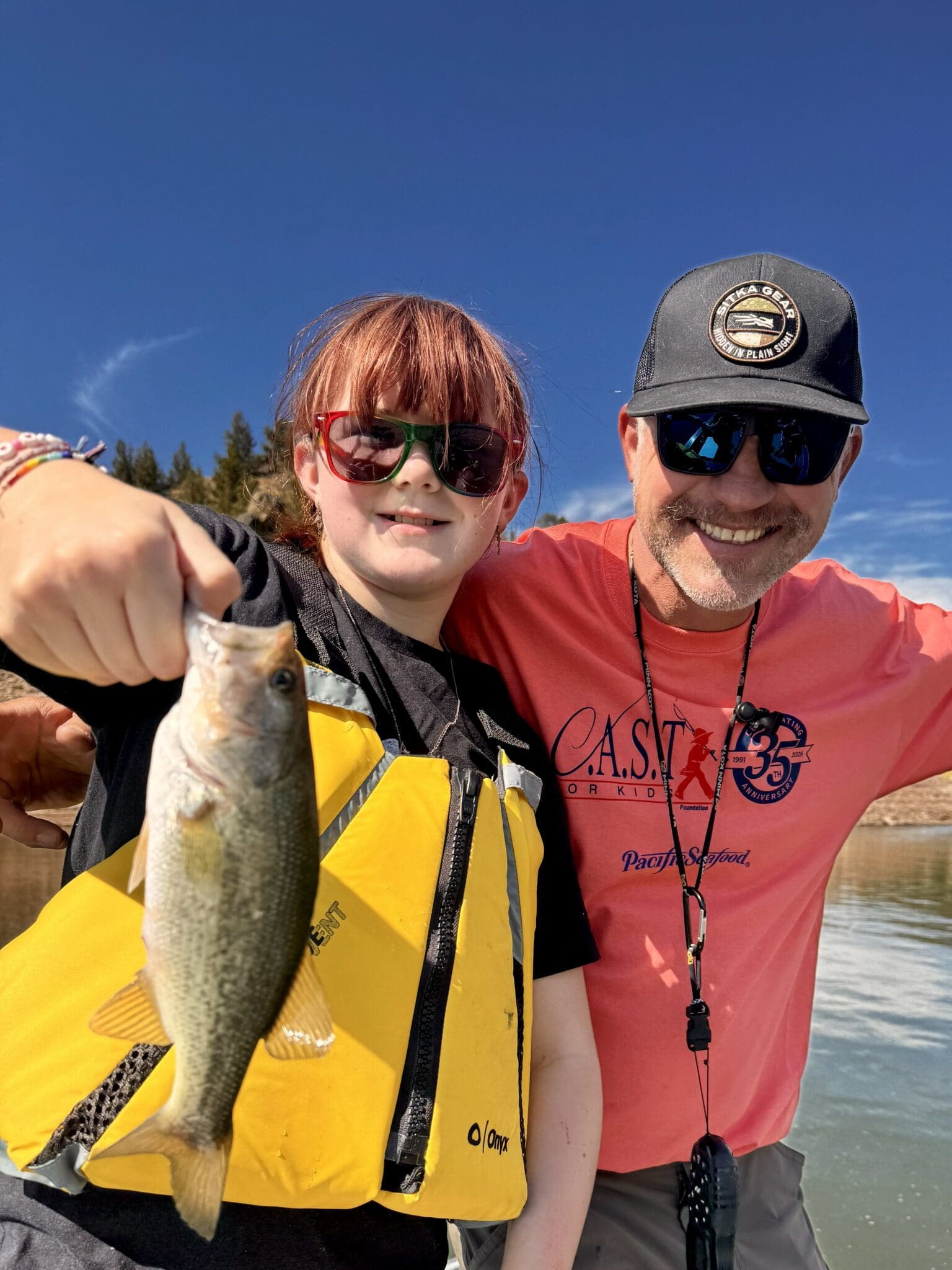 young boy showing fish at prineville reservoir