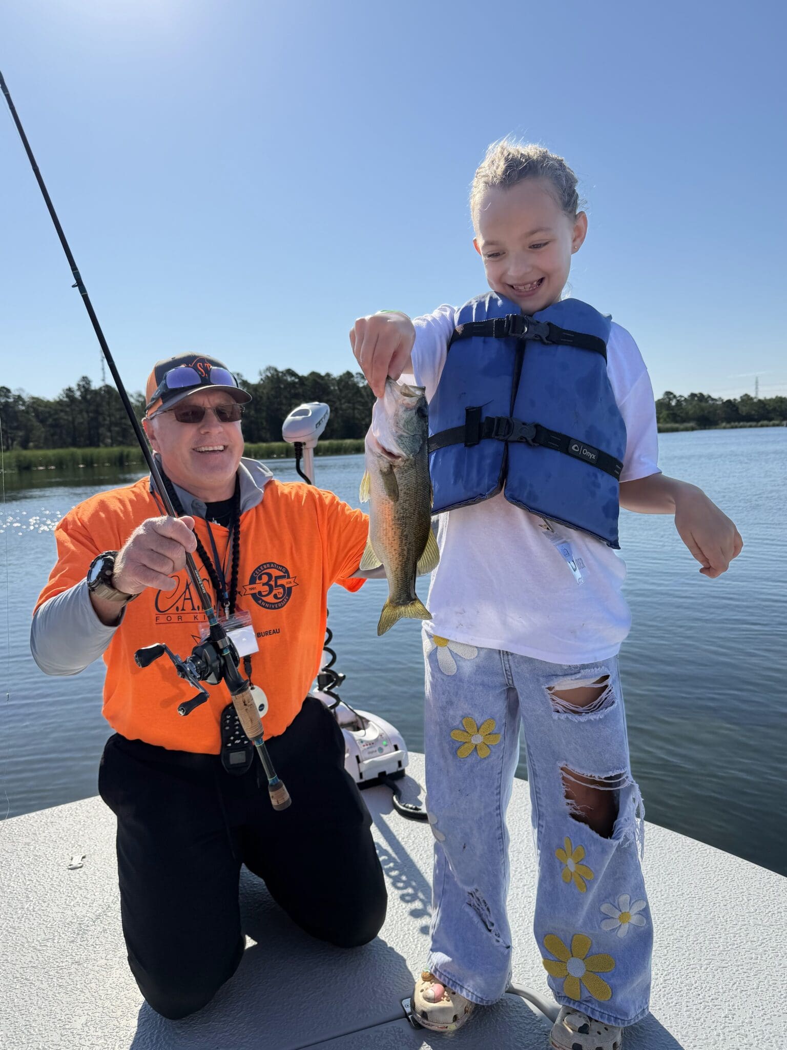 participants with fish on the boat