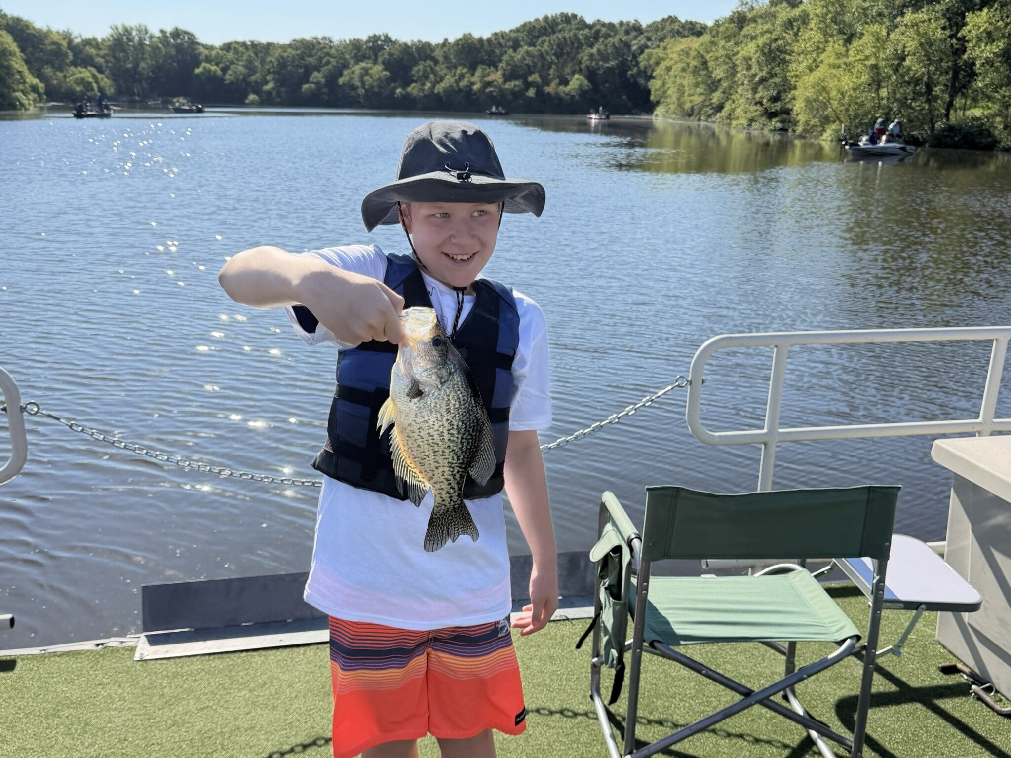 two young boys holding a fish at Kemp Lake