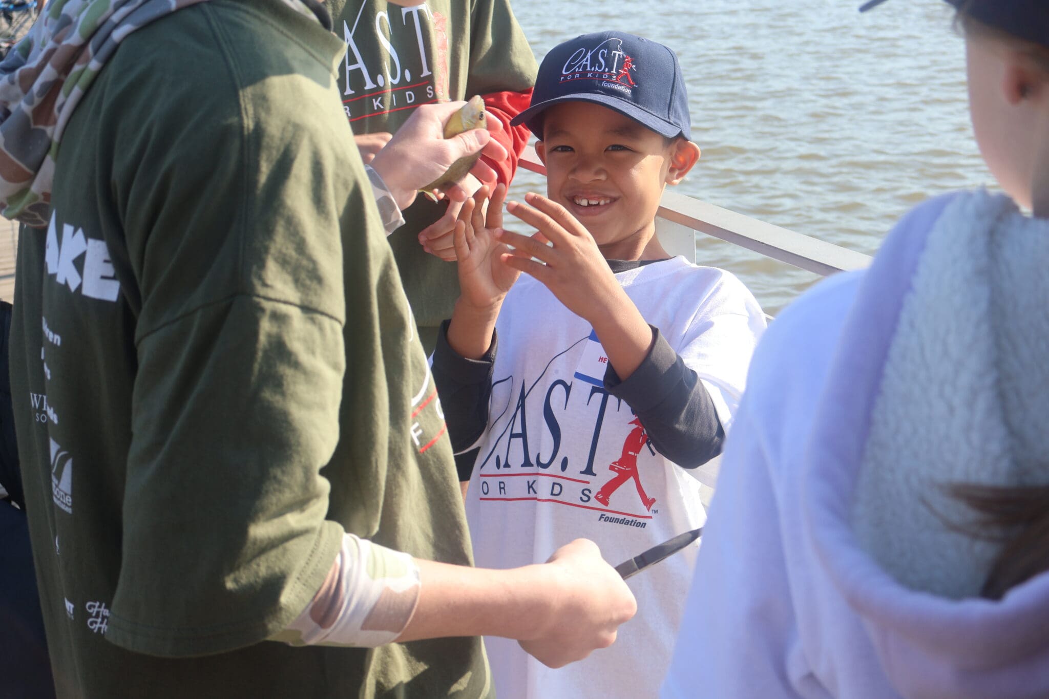 a kid looking at a fish