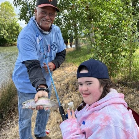 Mother and daughter showing off fish at lake charles