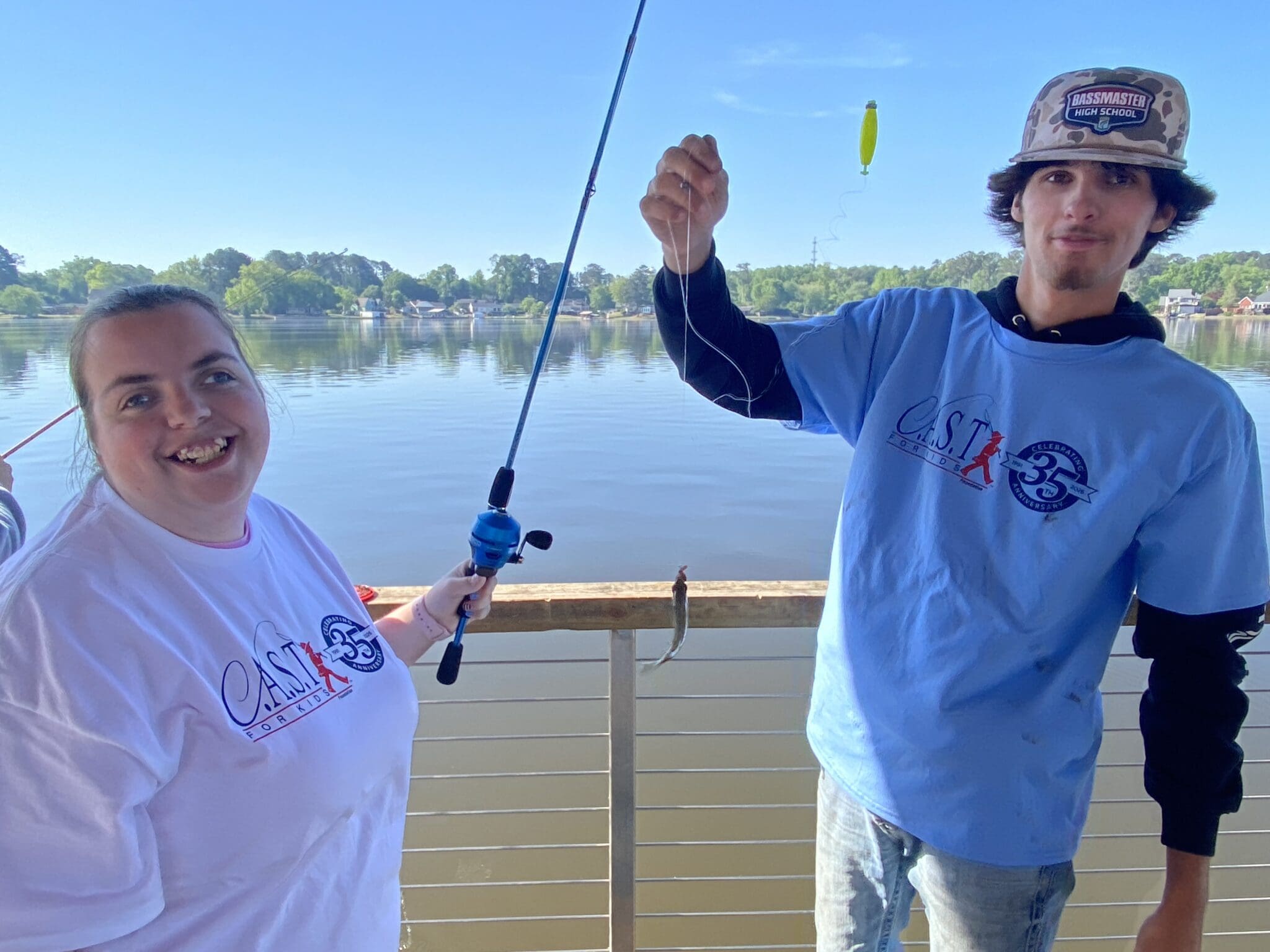 volunteer and participant with a fish