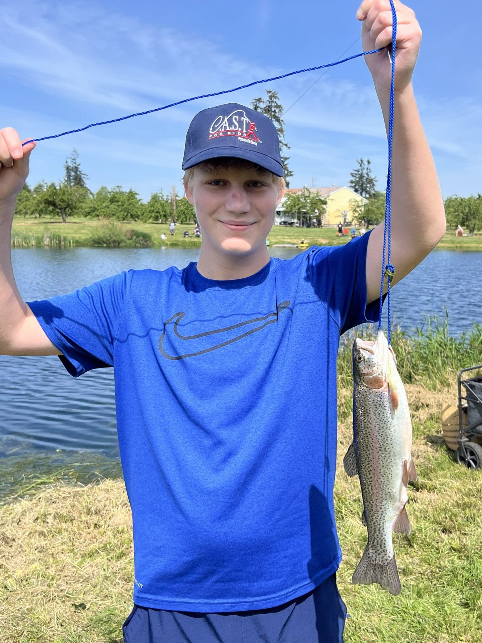 Participant showing off fish at Pearland Bass Pro Shops