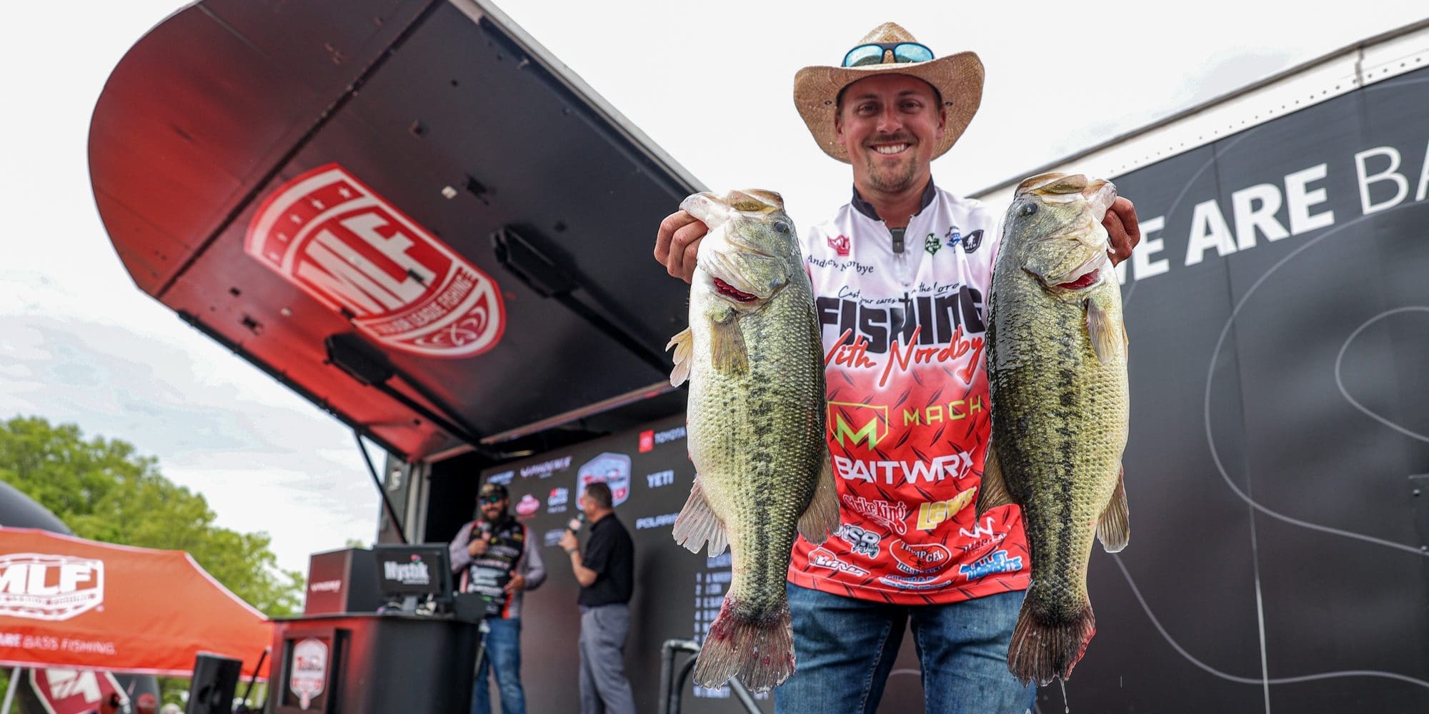 andrew nordbye holding 2 fish
