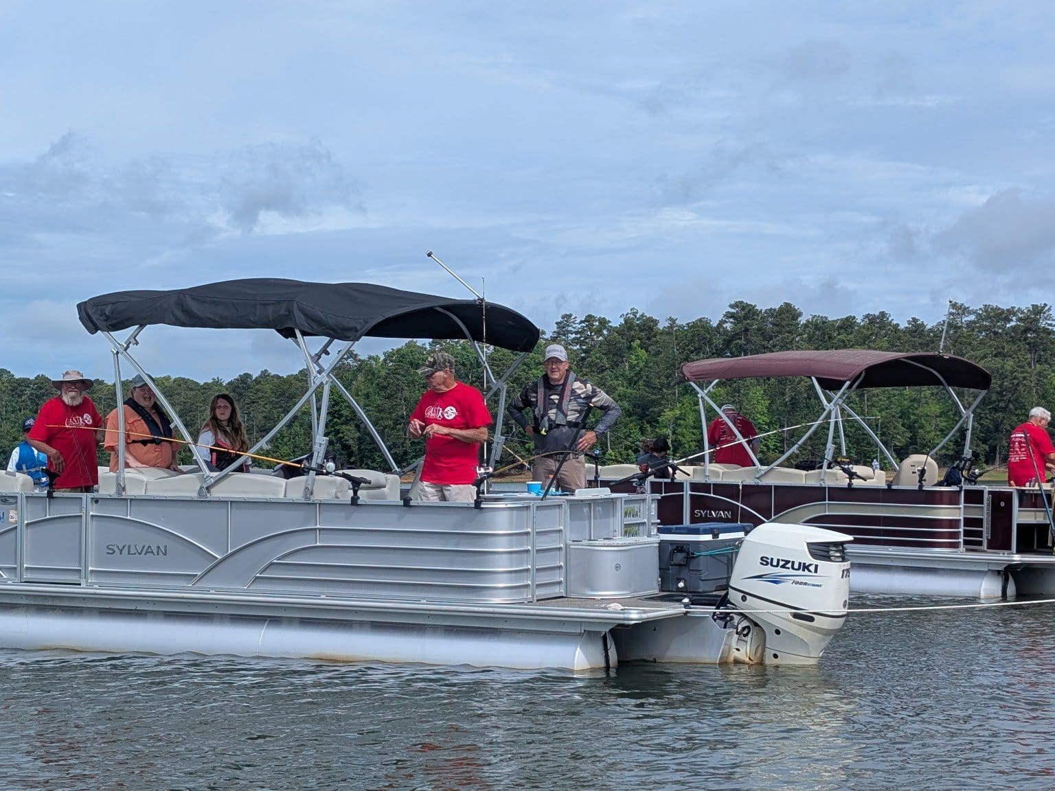 child waving on boat at lake thurmond