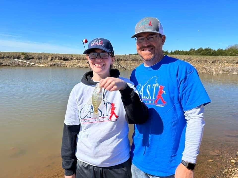 participant showing fish at Duncan Lake Pavilion