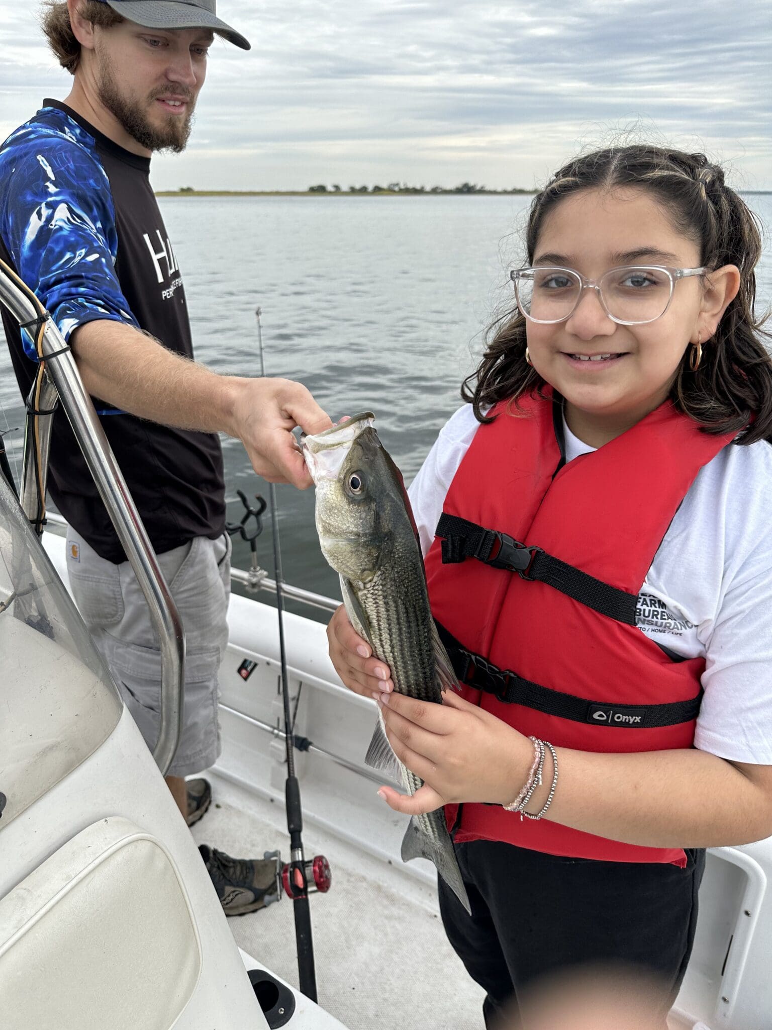 Participant showing off fish at clear lake