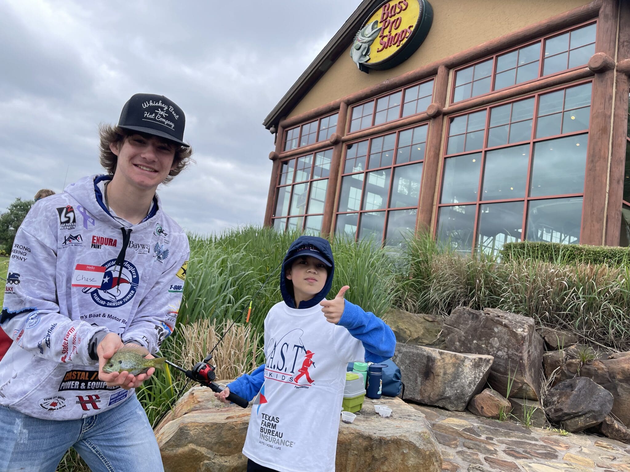 Participant showing off fish at Pearland Bass Pro Shops