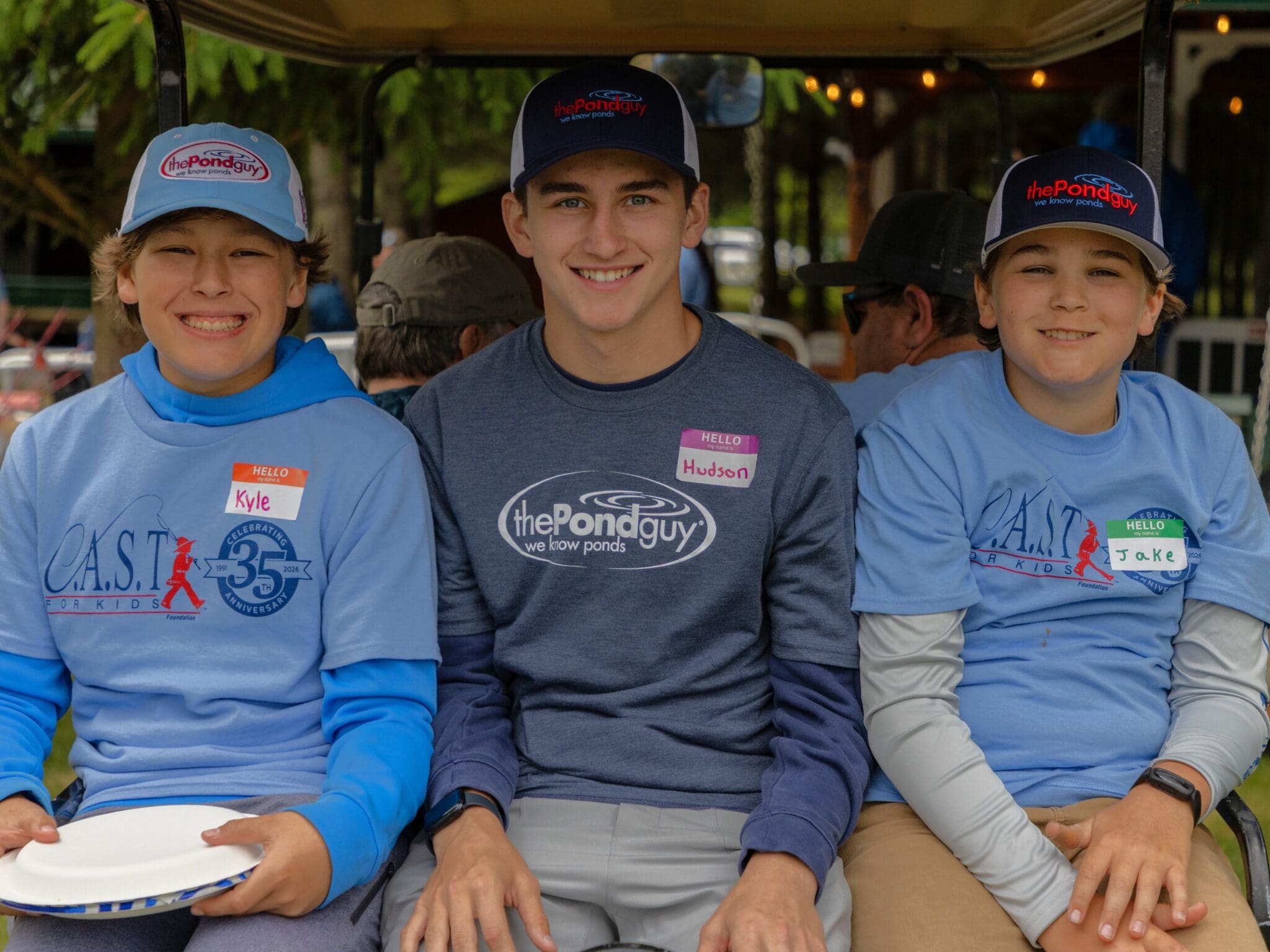 young participant holding fish at Happy Day