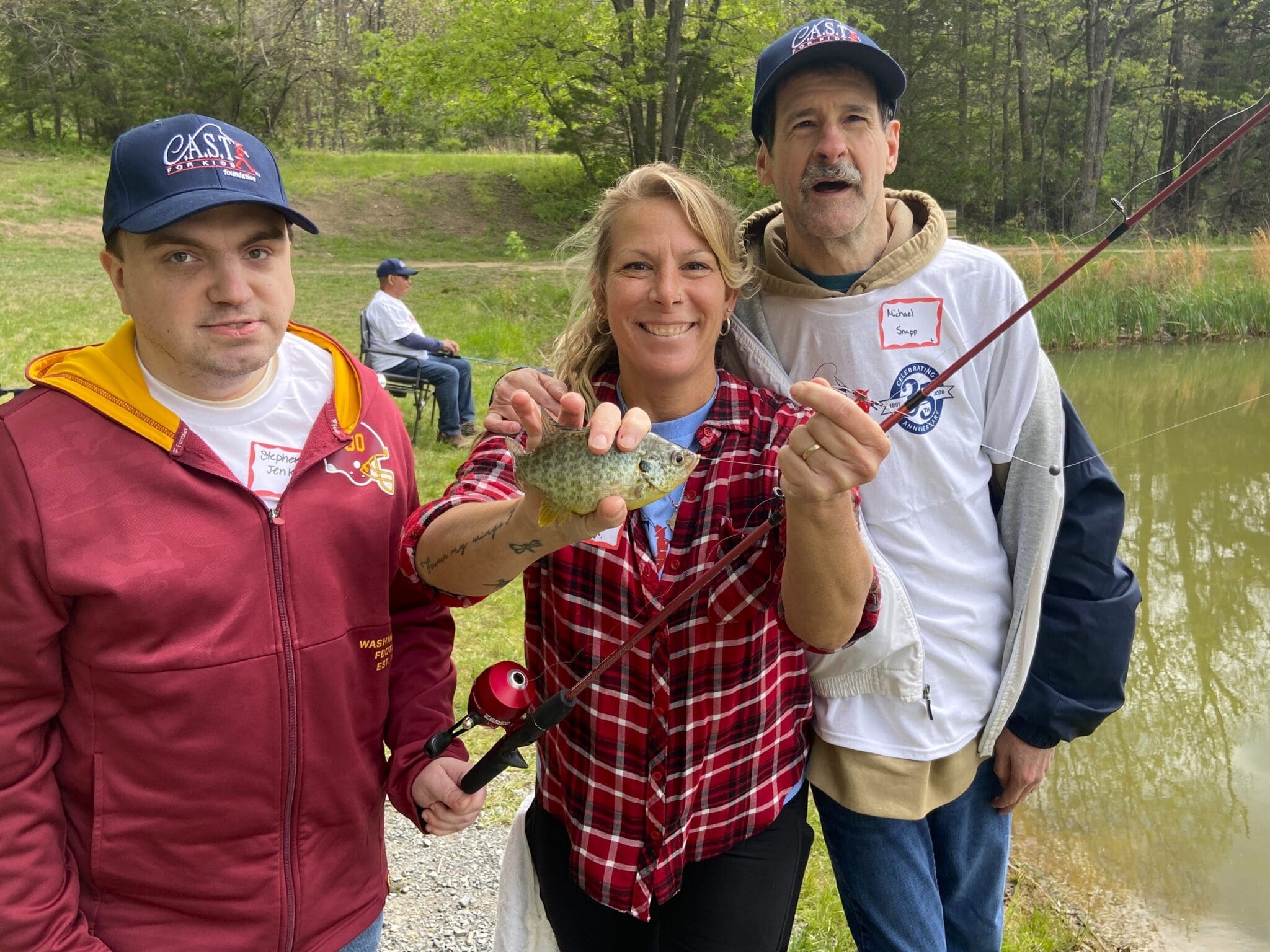 participant showing off fish at Saugatuck River