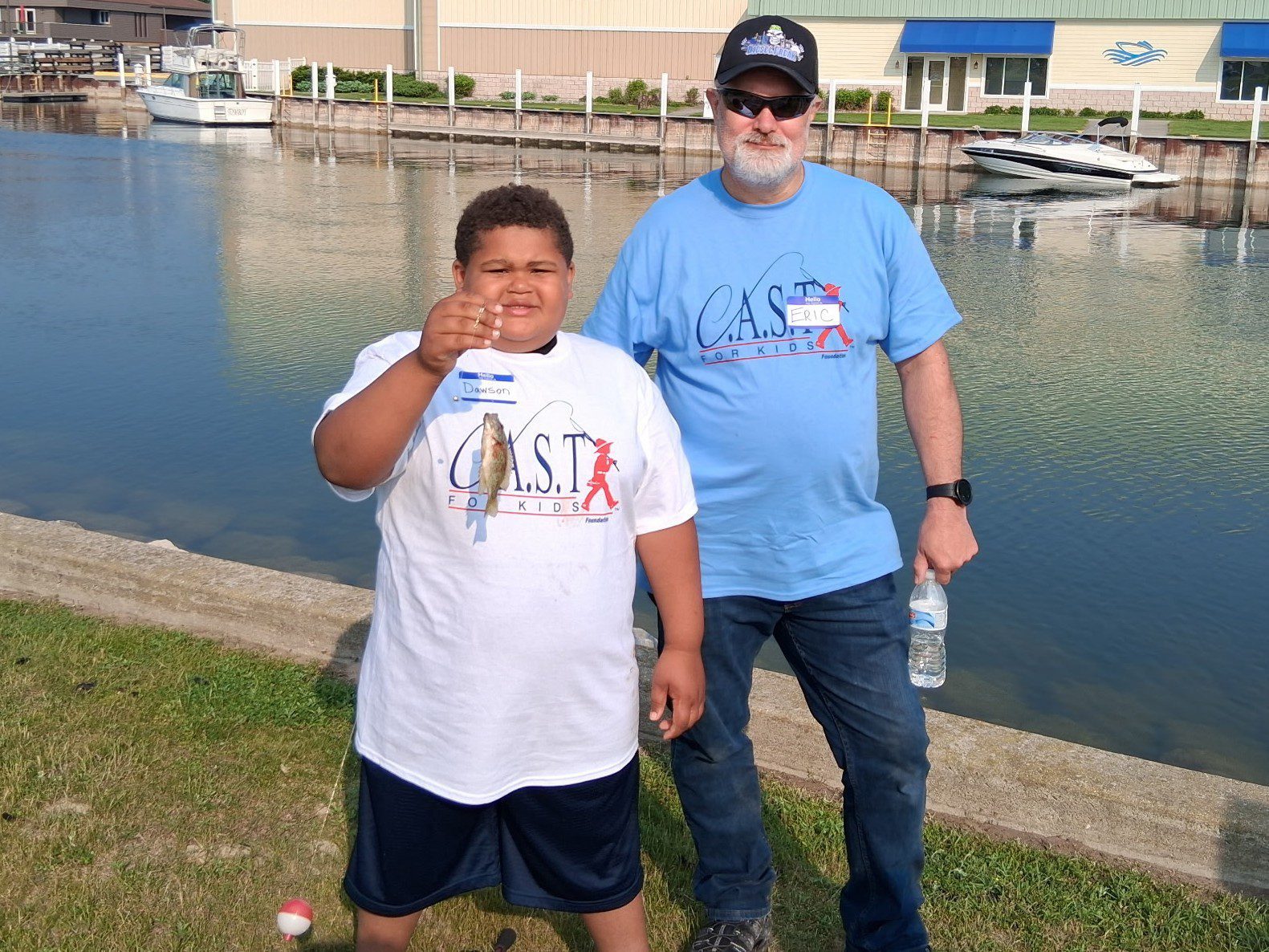 young boy showing off fish at Cheboygan
