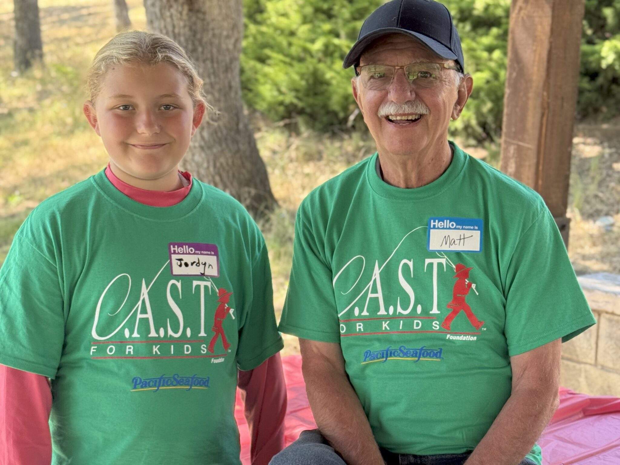 two participants with green shirts at emigrant lake