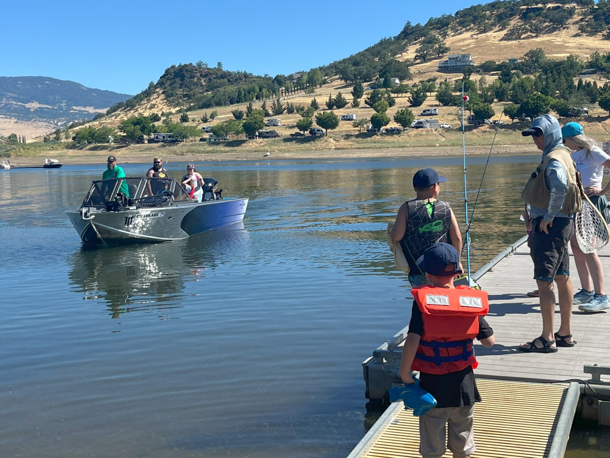 people on boat at emigrant lake