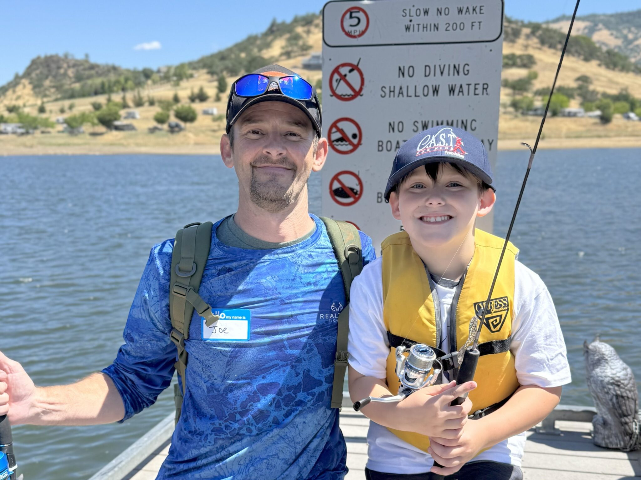 young boy with fishing pole at emigrant lake