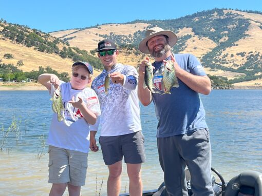 three participants with fish at emigrant lake