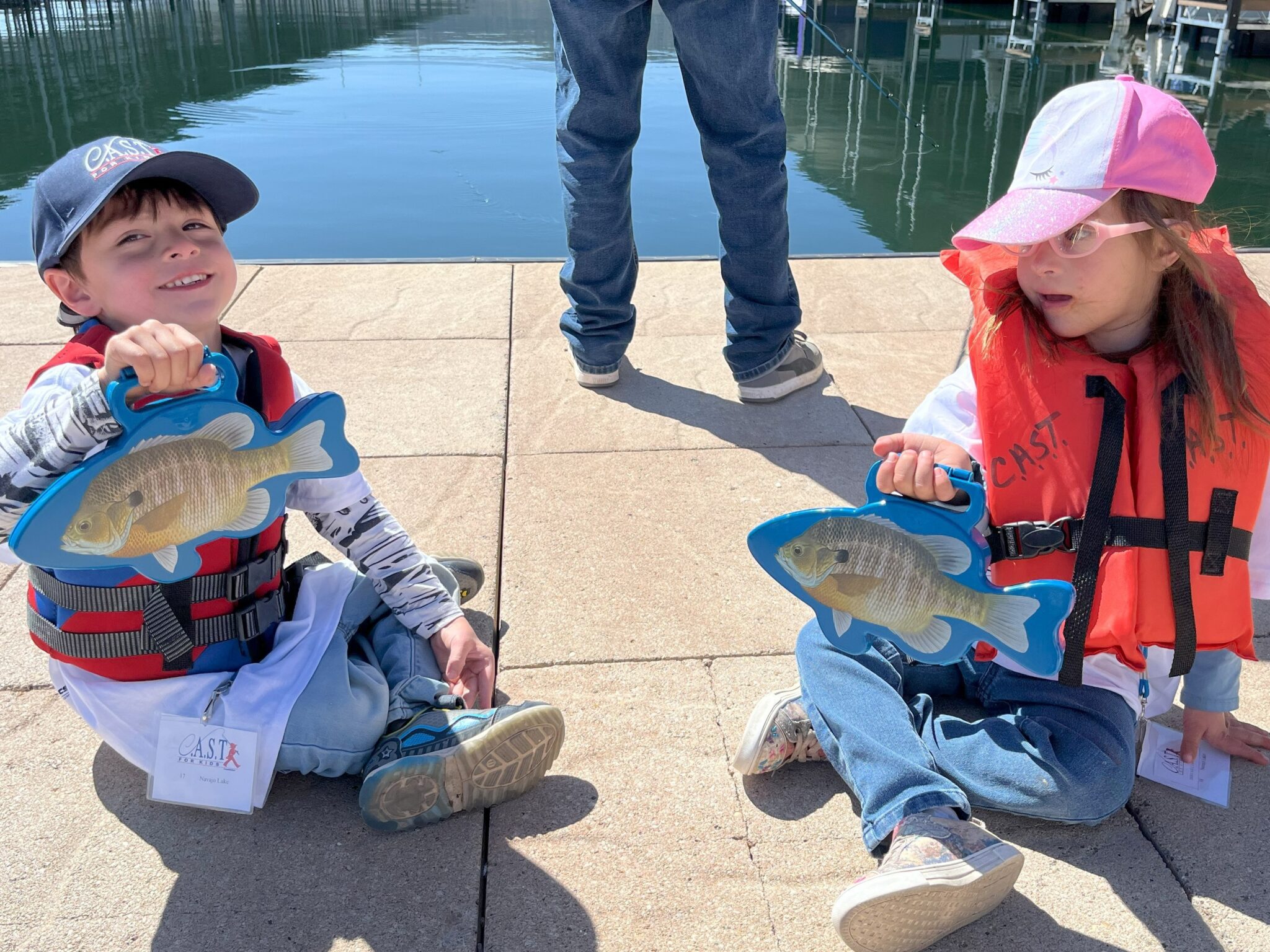 two children with fish at navajo lake