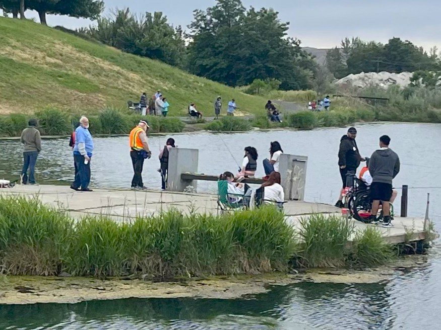 group of participants on shoreline at sarg hubbard pond