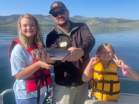 three participants showing off fish at strawberry reservoir
