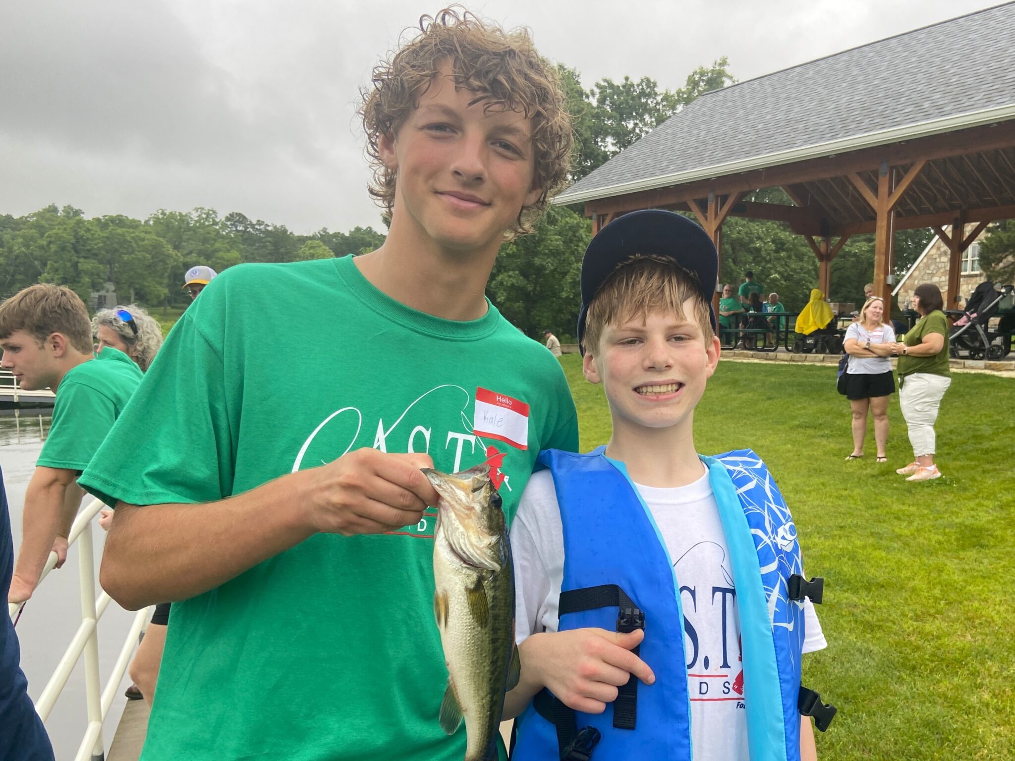 two participants holding a fish at Kemp Lake