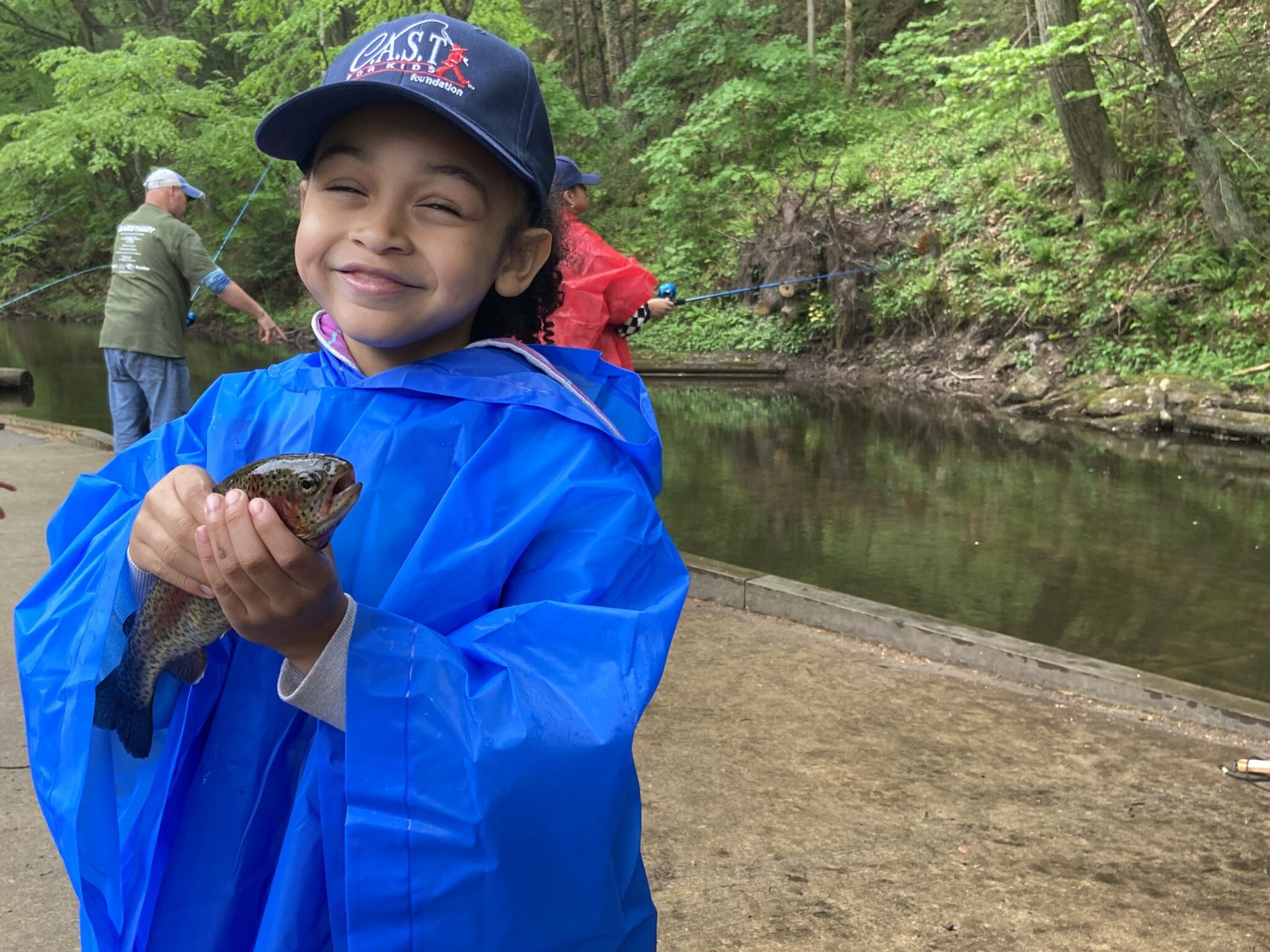 two participants showing a fish at Clarks Valley