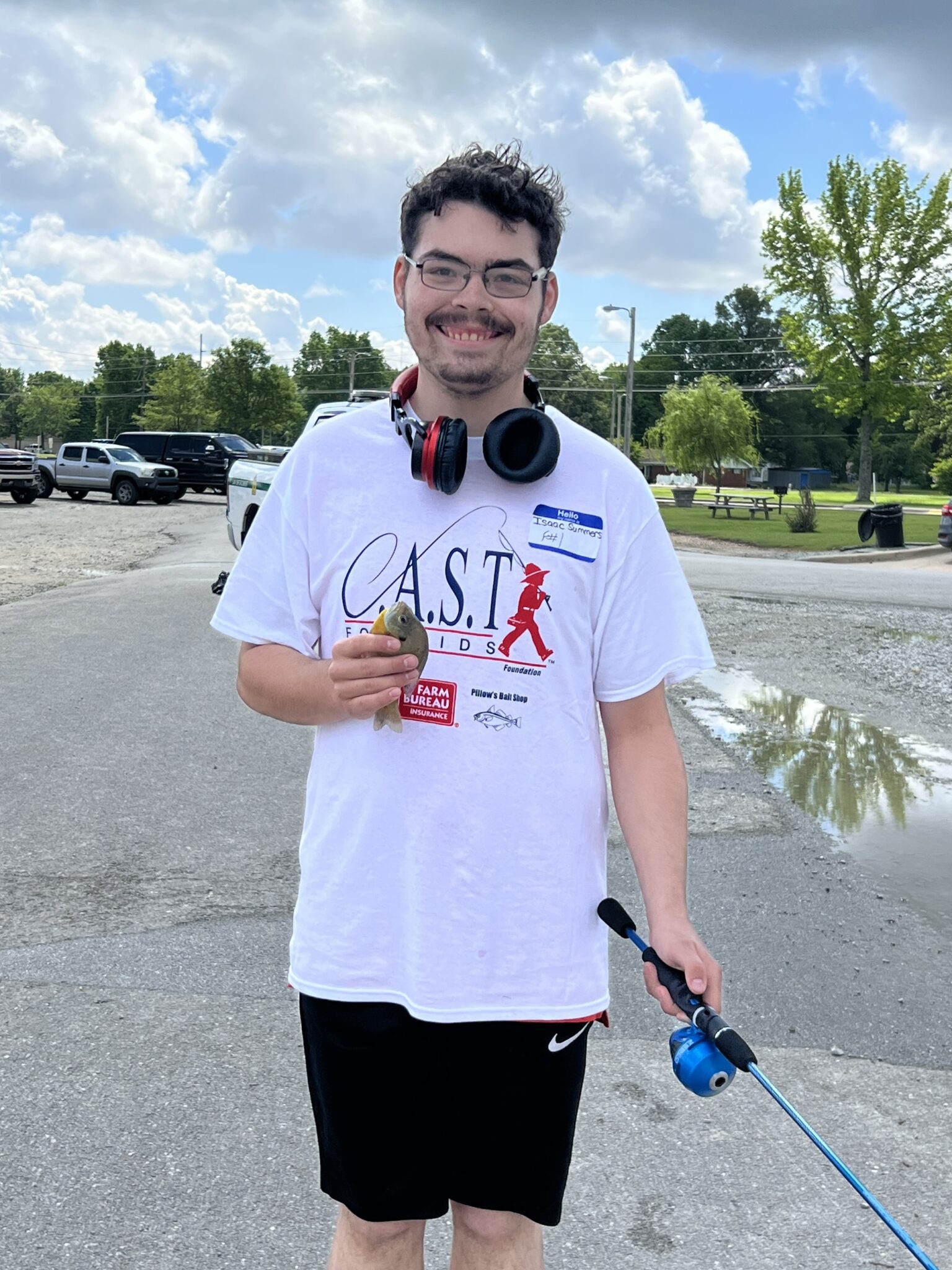 participant on boat holding a fish