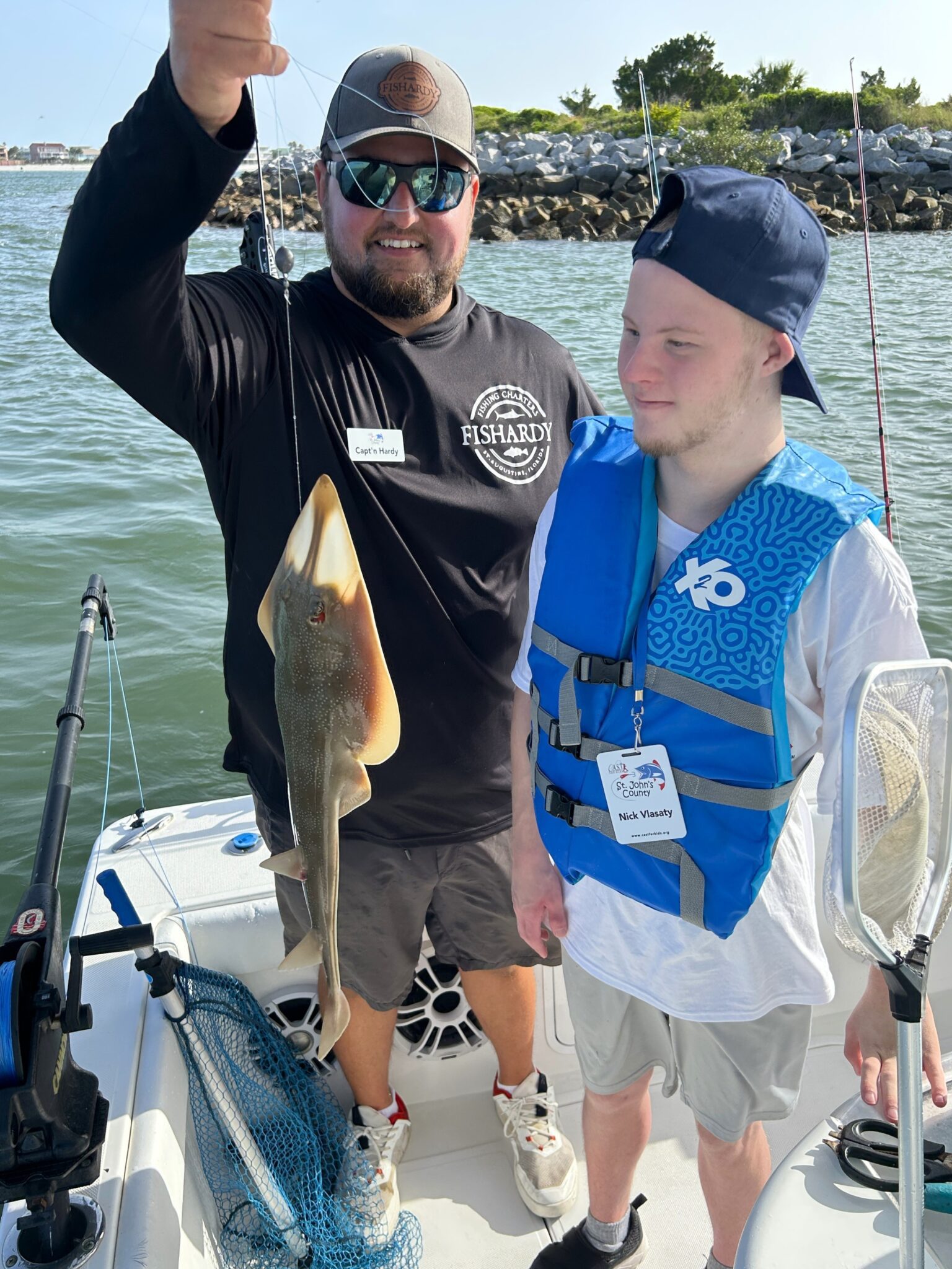 young kid showing off fish at st johns county