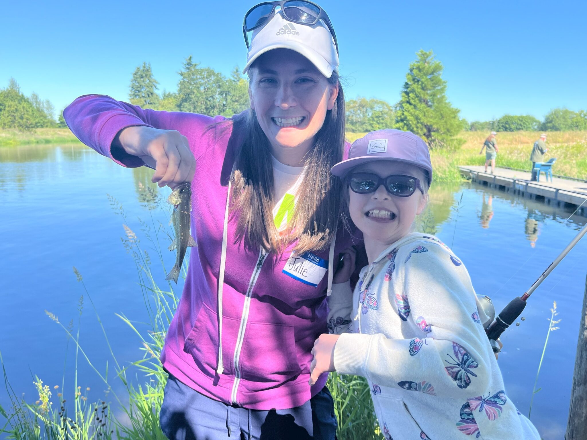 Mother and daughter showing off fish at lake charles