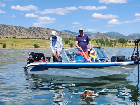 people on boat at chatfield reservoir