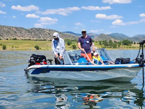 people on boat at chatfield reservoir