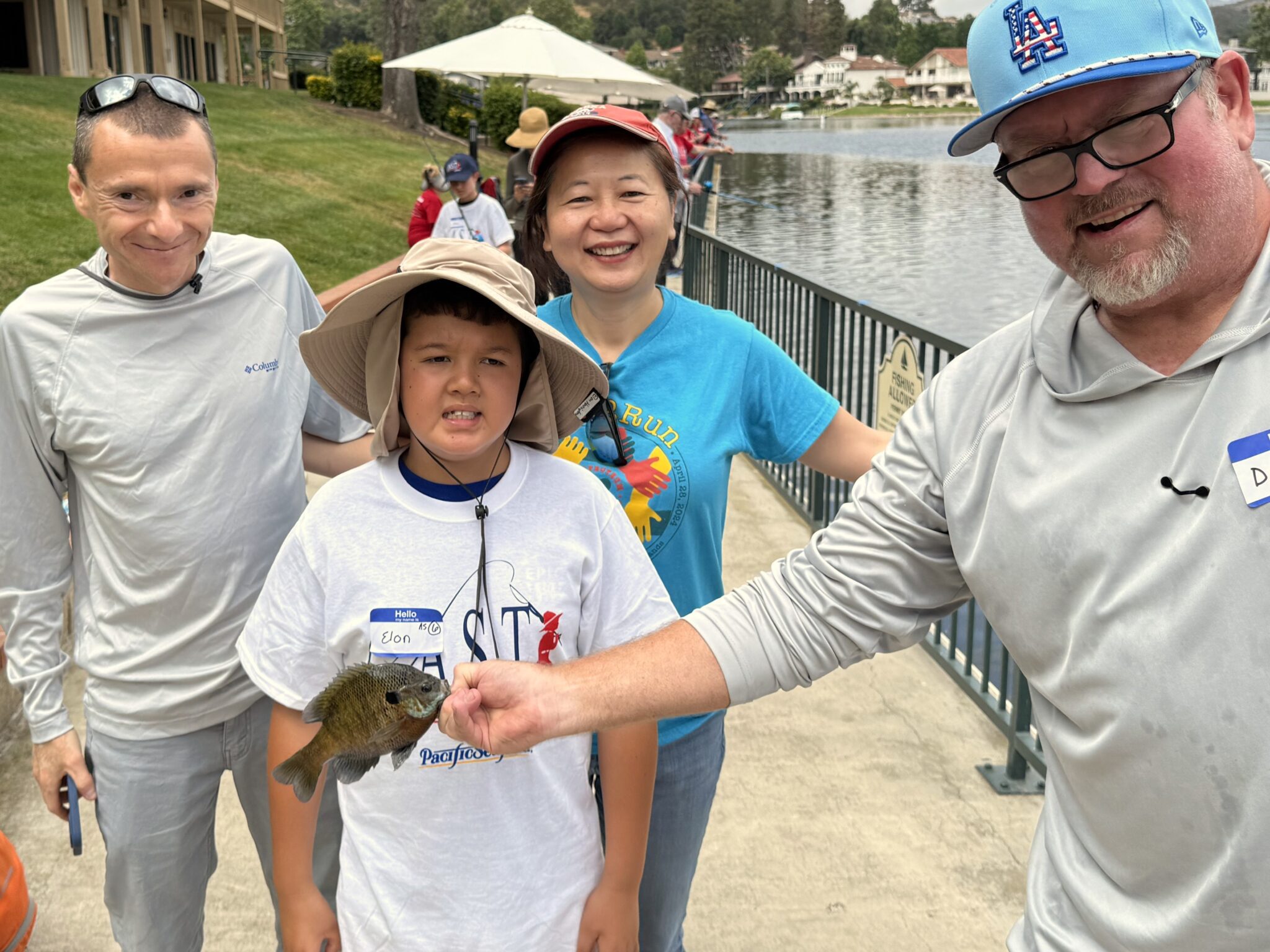 Joyous participant with fish at west lake village