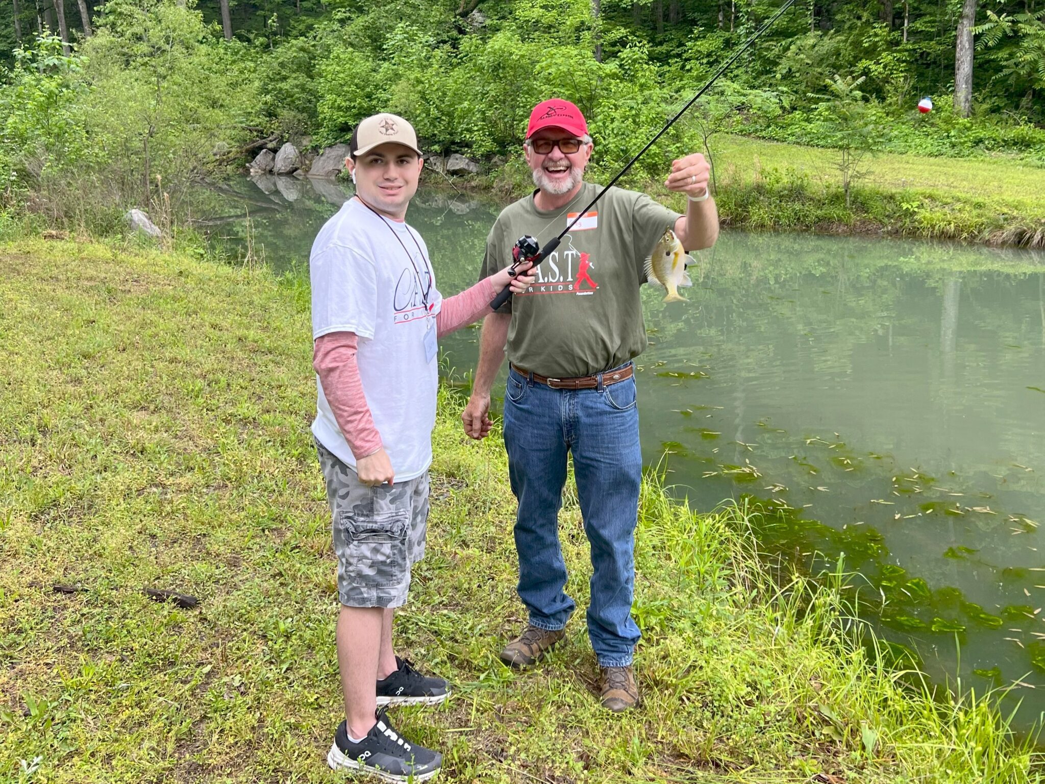 two people holding fish at chandler branch