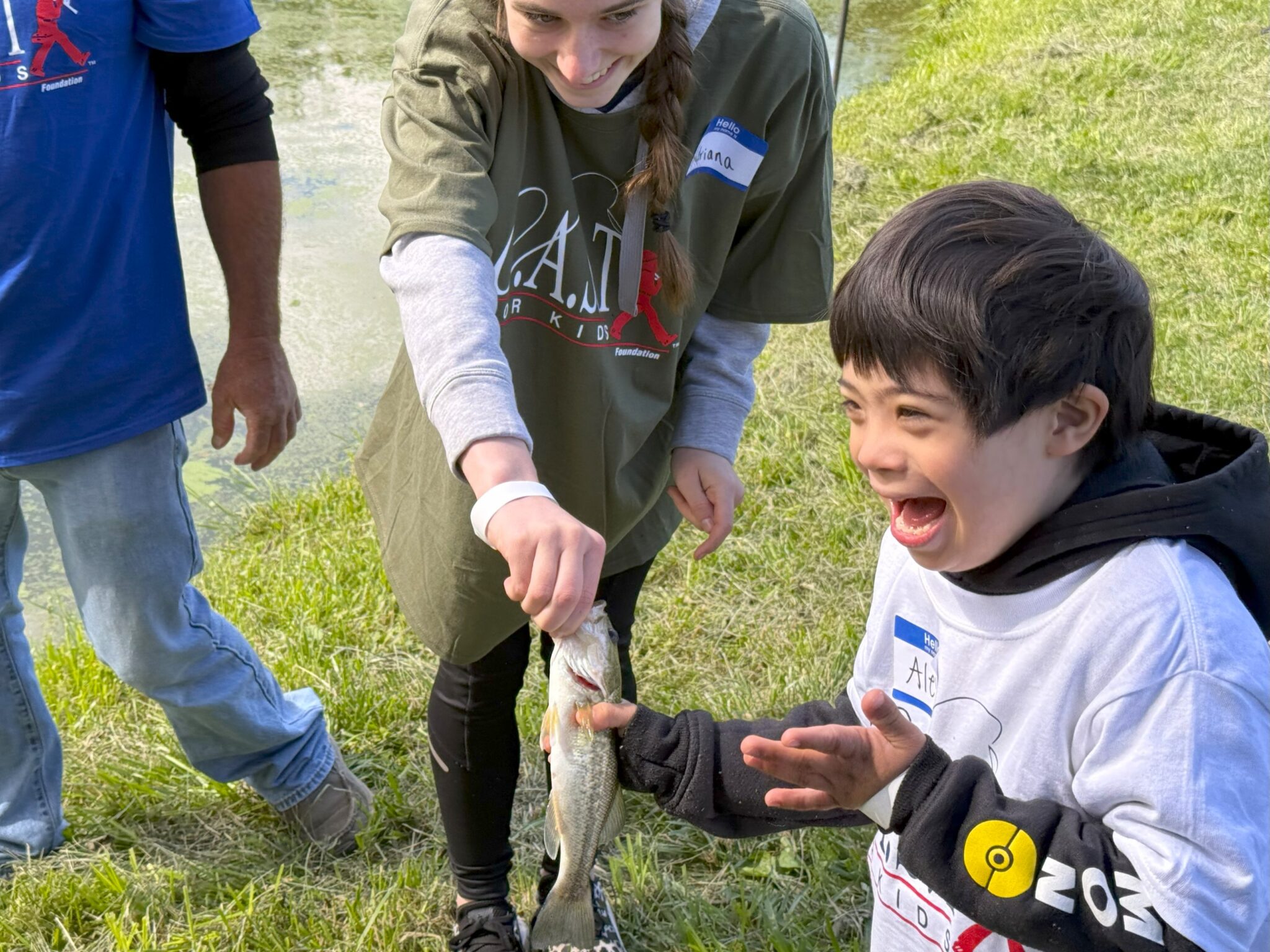 young child excited about fish at spotted dog pond