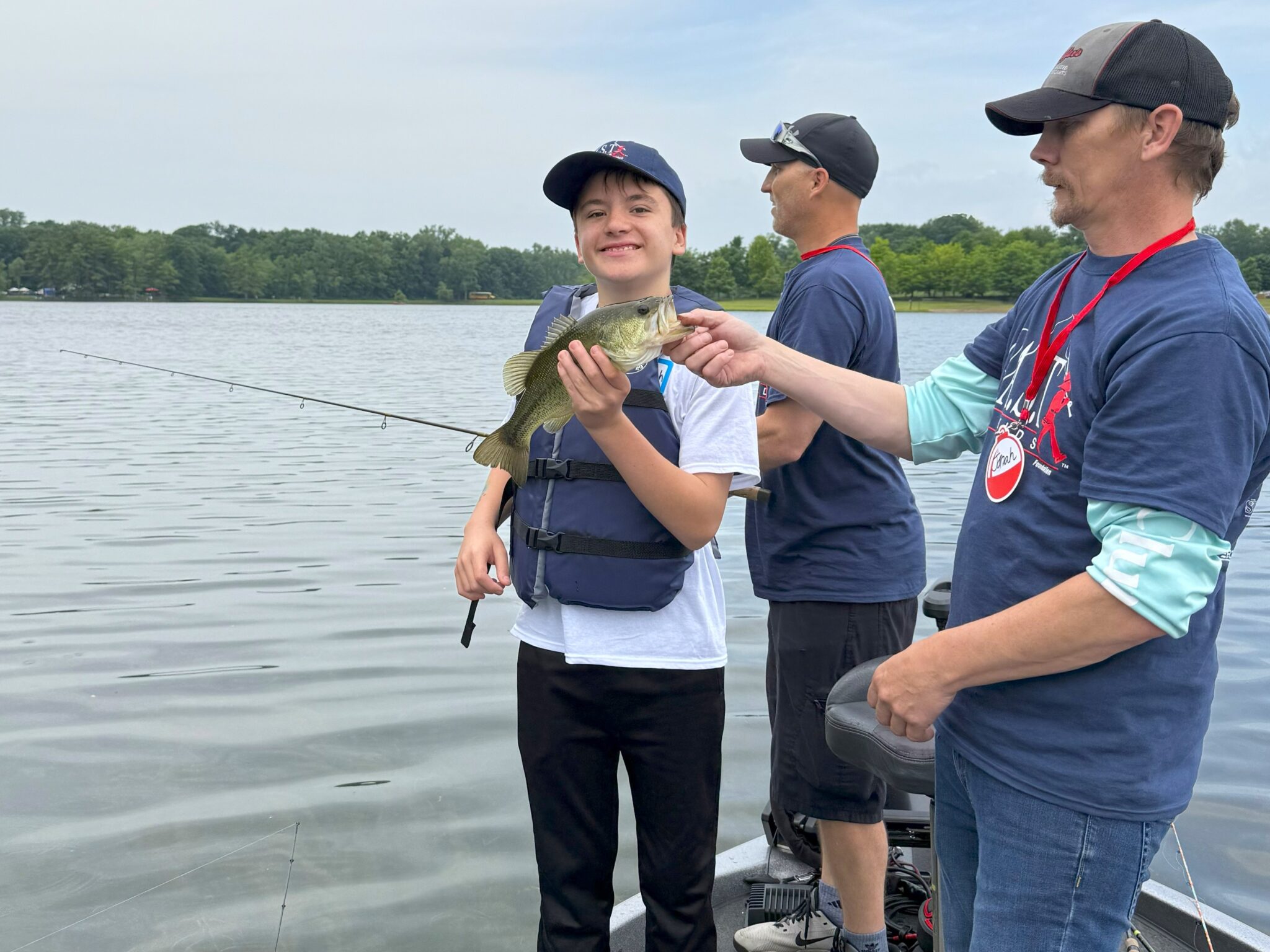 three participants on boat at big seven lake