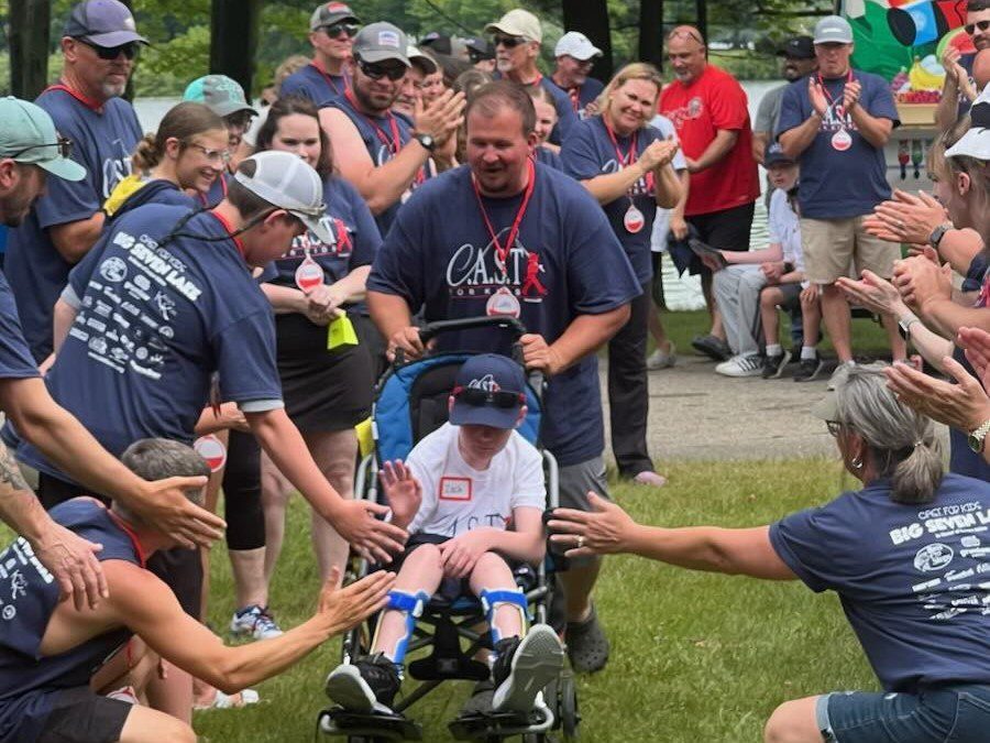 child surrounded by people at big seven lake