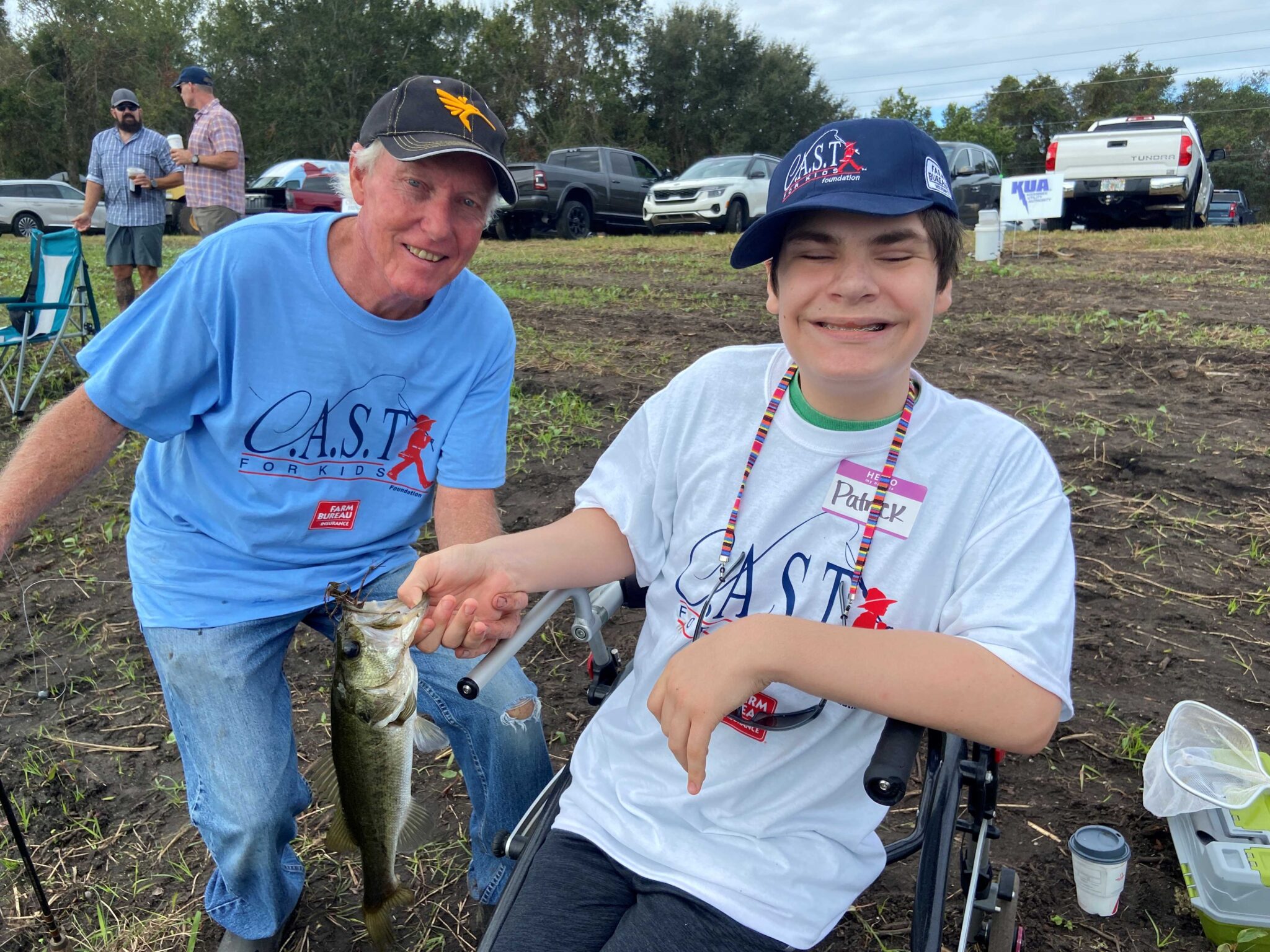Youth fishing with a volunteer