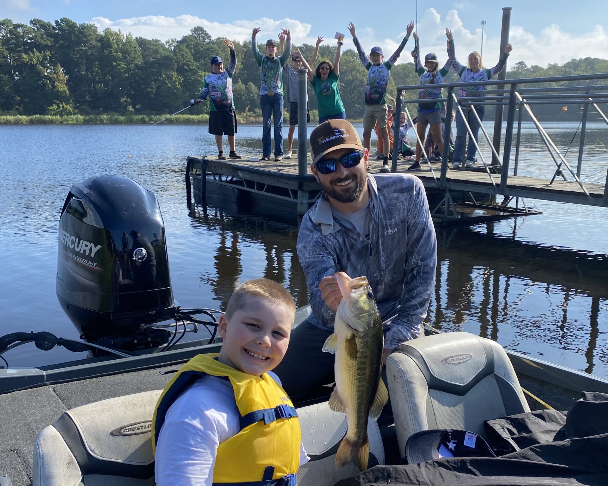 IndianLake4 young boy showing off fish at Indian Lake Clubhouse