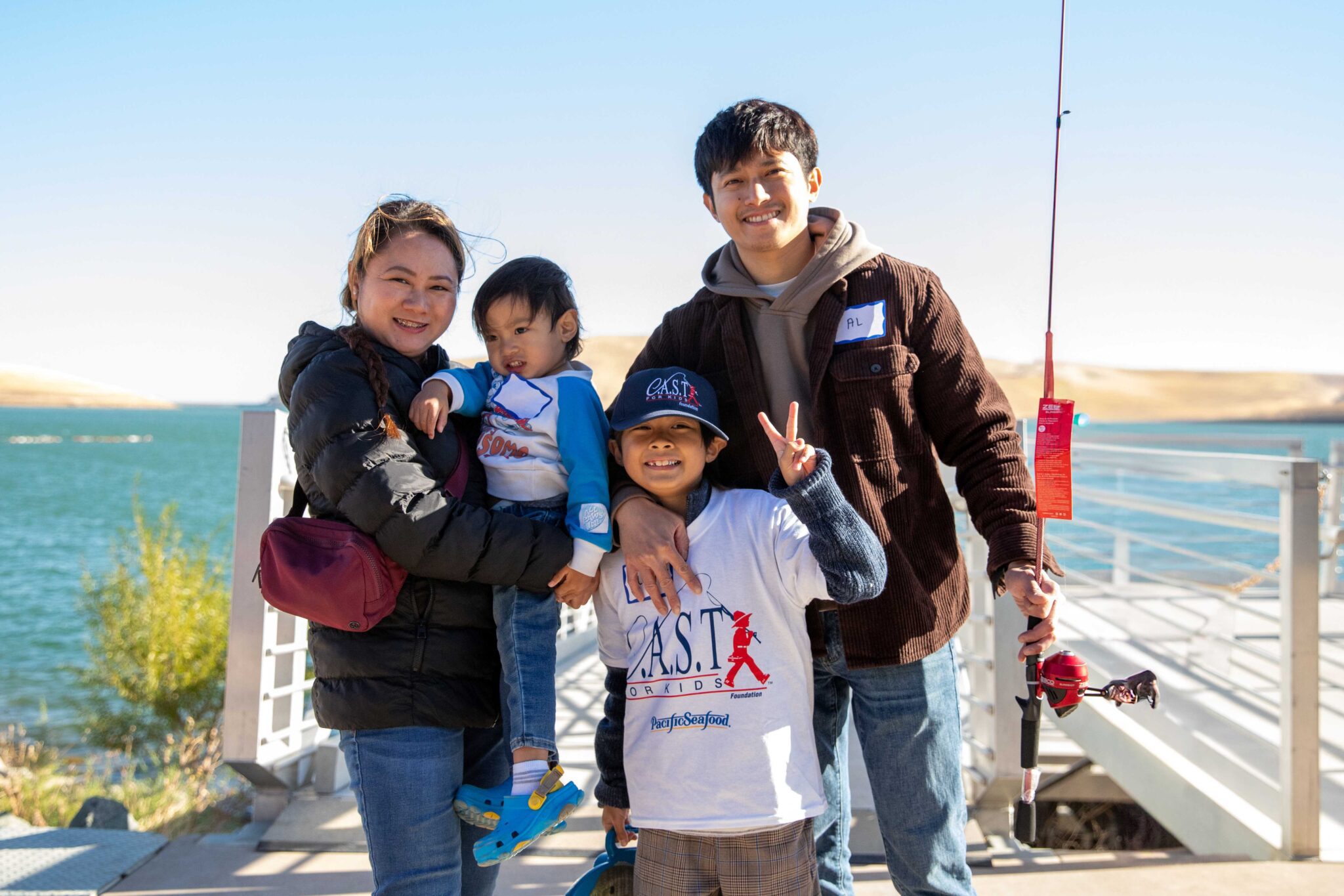 family at a CAST for Kids fishing event
