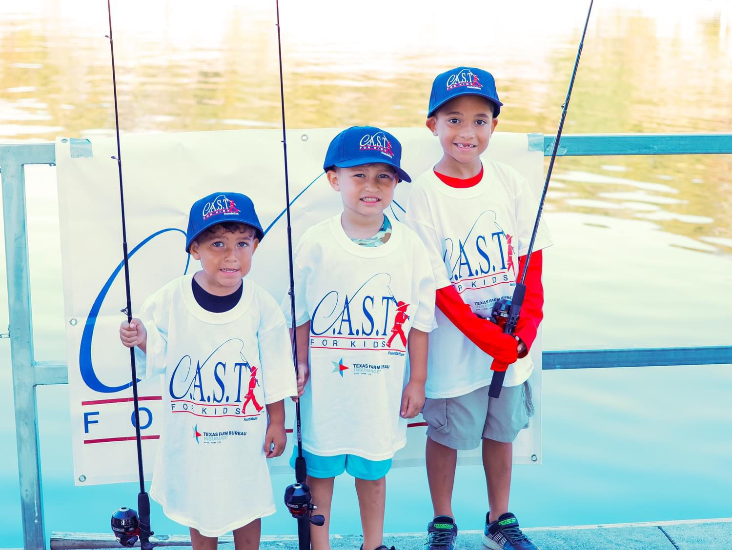 3 boys with fishing poles