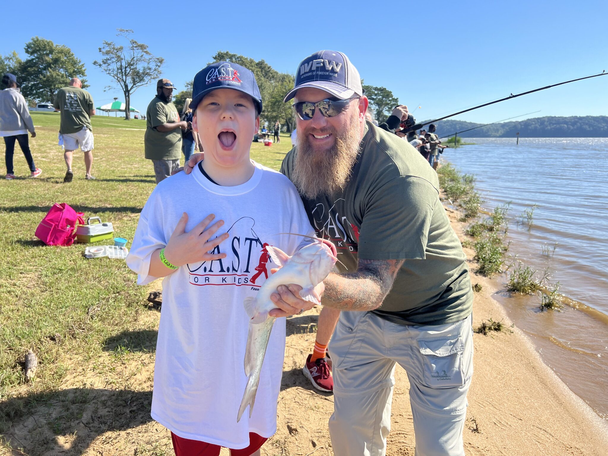 kid with a volunteer fishing