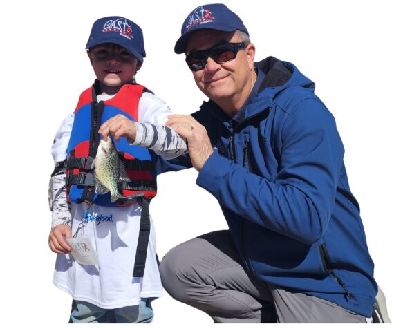 kid holding a fish and Jay Yelas