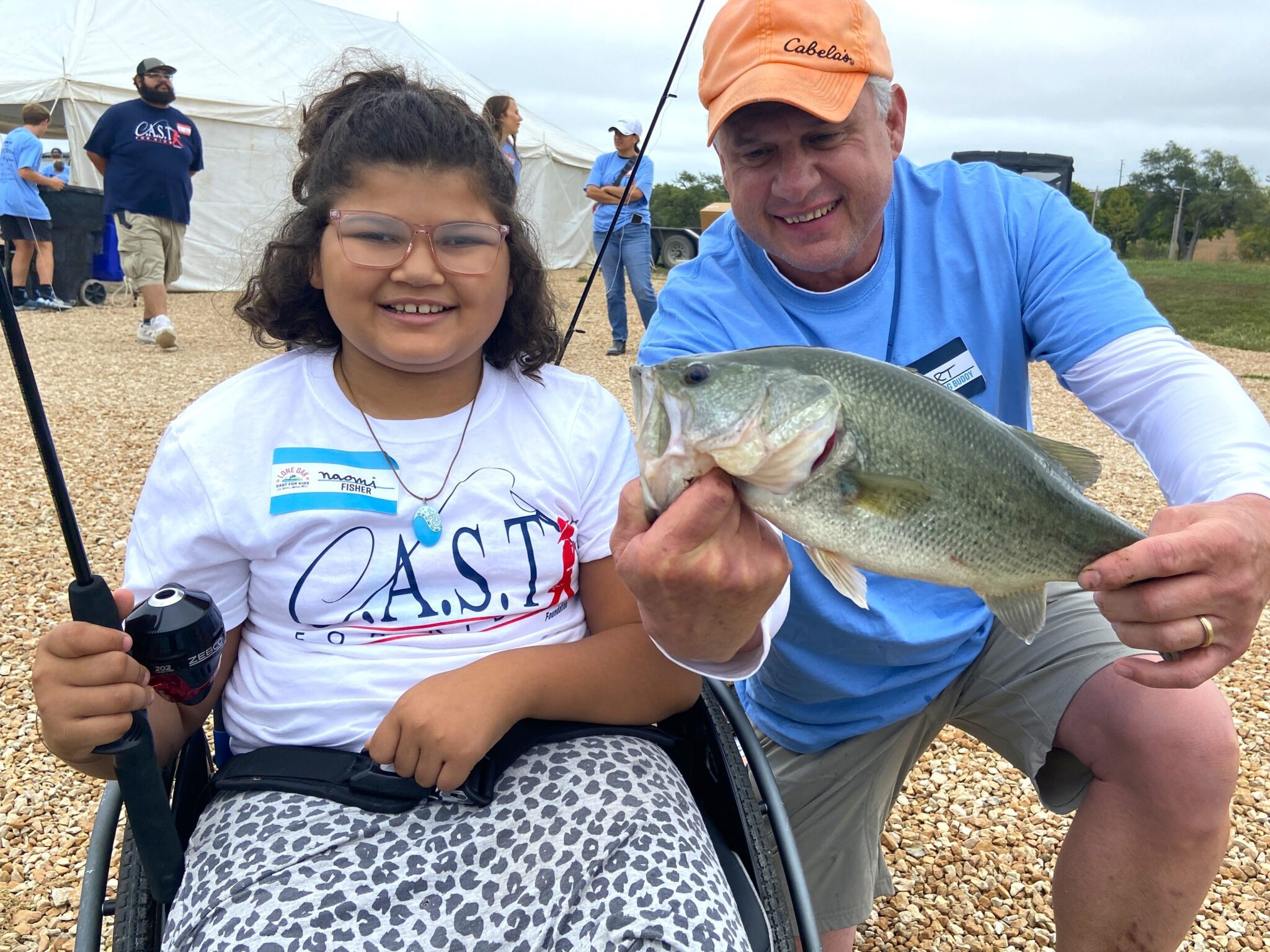 participant showing off fish at Saugatuck River