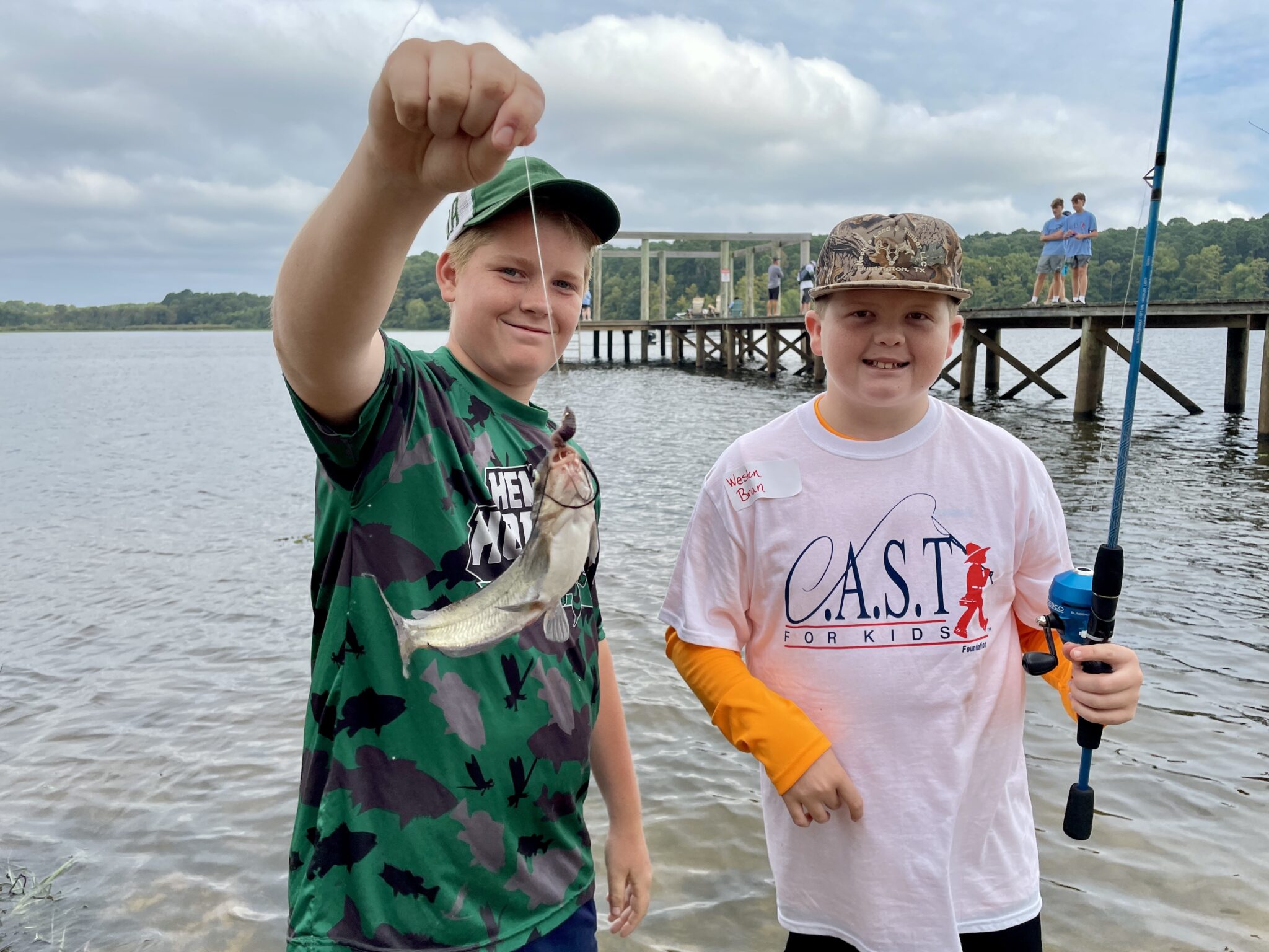 2 participants with fishing poles
