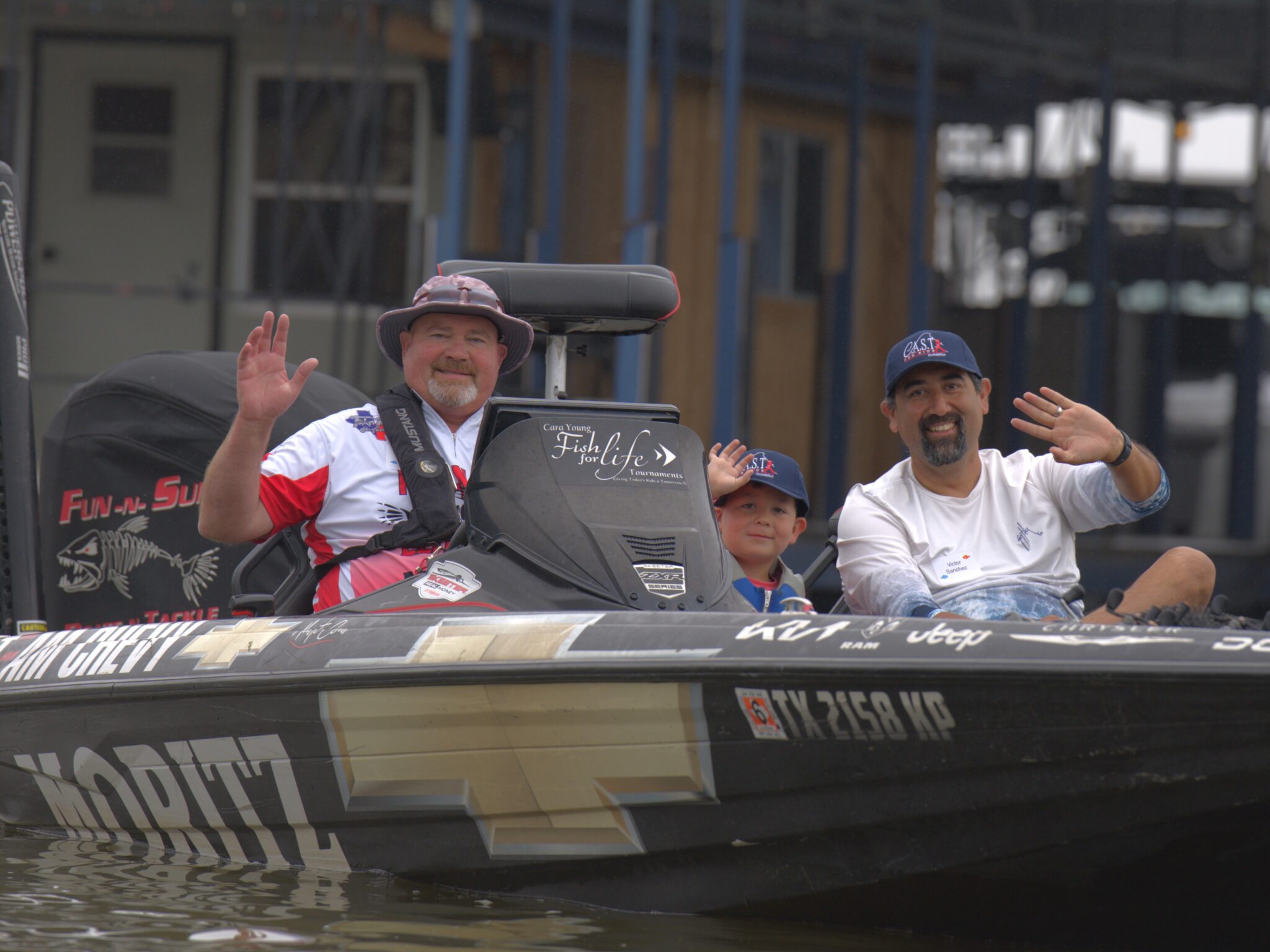 volunteer and participant with a fish