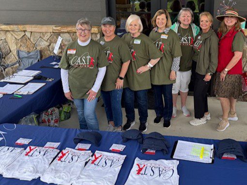 volunteer and participant with a fish