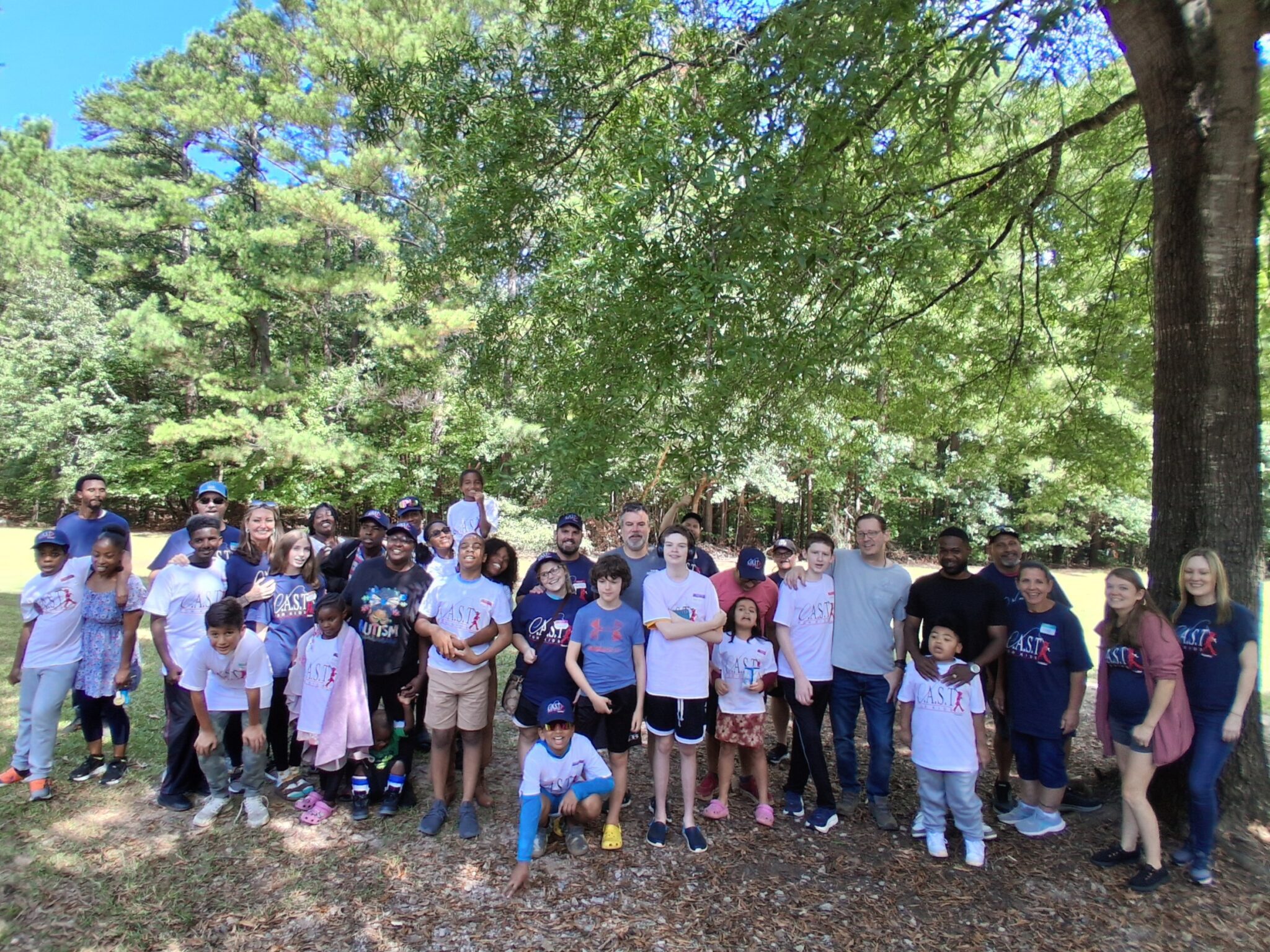 child showing off fish at Lake Wheeler