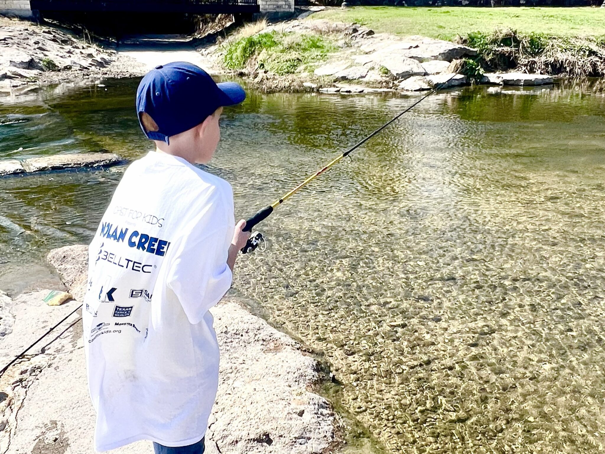 participant showing off fish at Saugatuck River